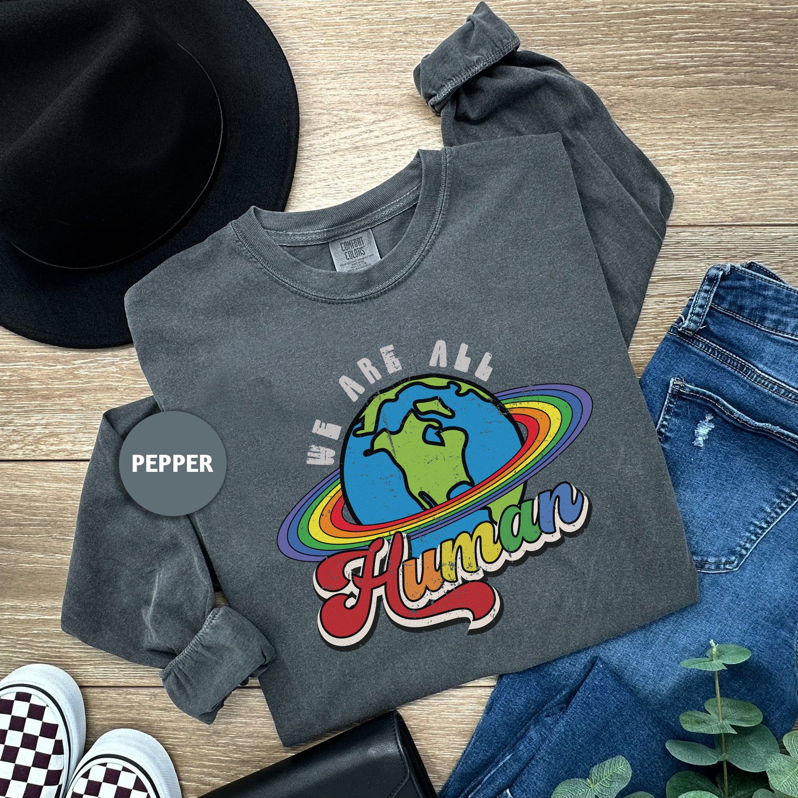 a t - shirt that says we are all humans on it