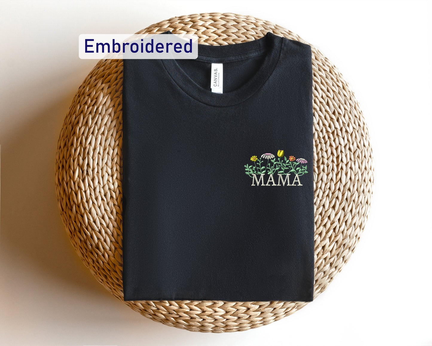 a black t - shirt with the name mama on it