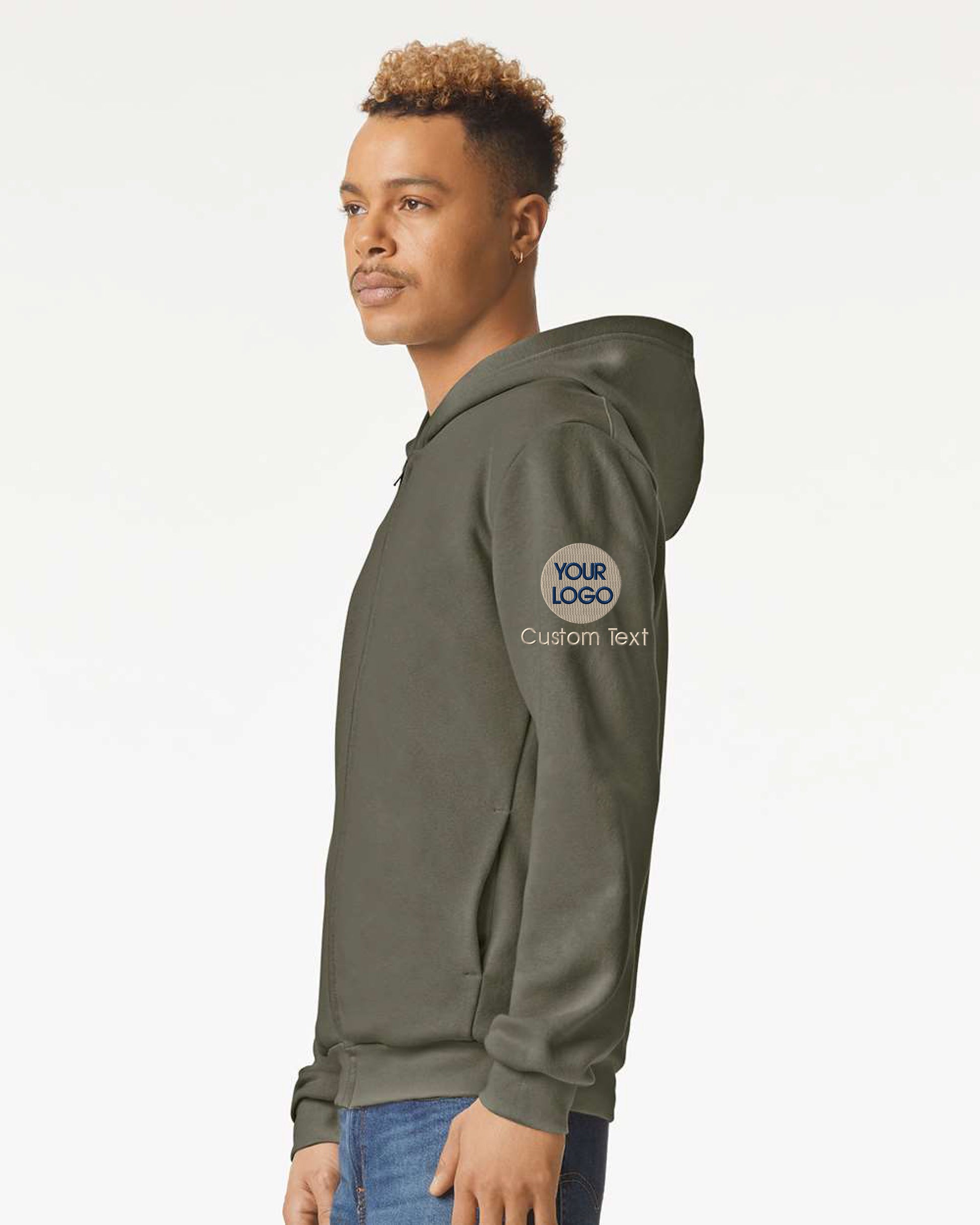 a young man wearing a green hoodie with a white logo on it