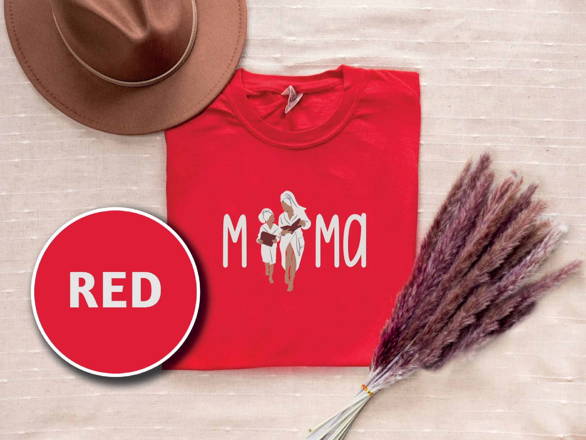 a red shirt and a hat on a bed