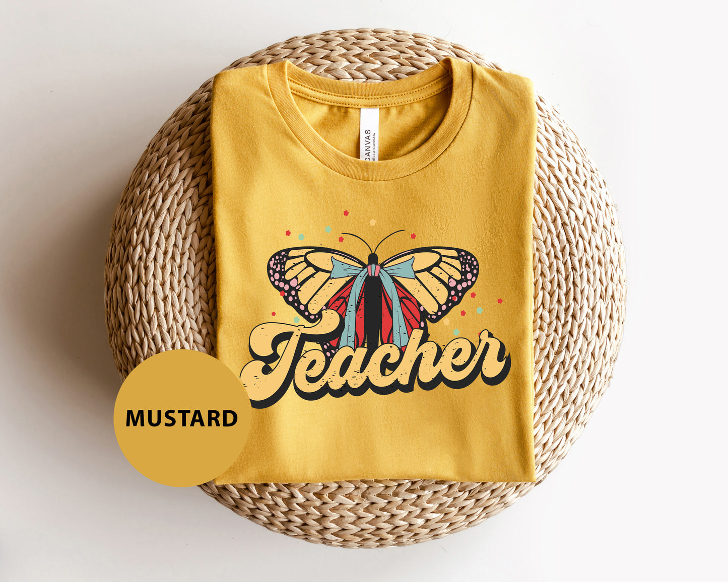 a yellow t - shirt with a butterfly on it