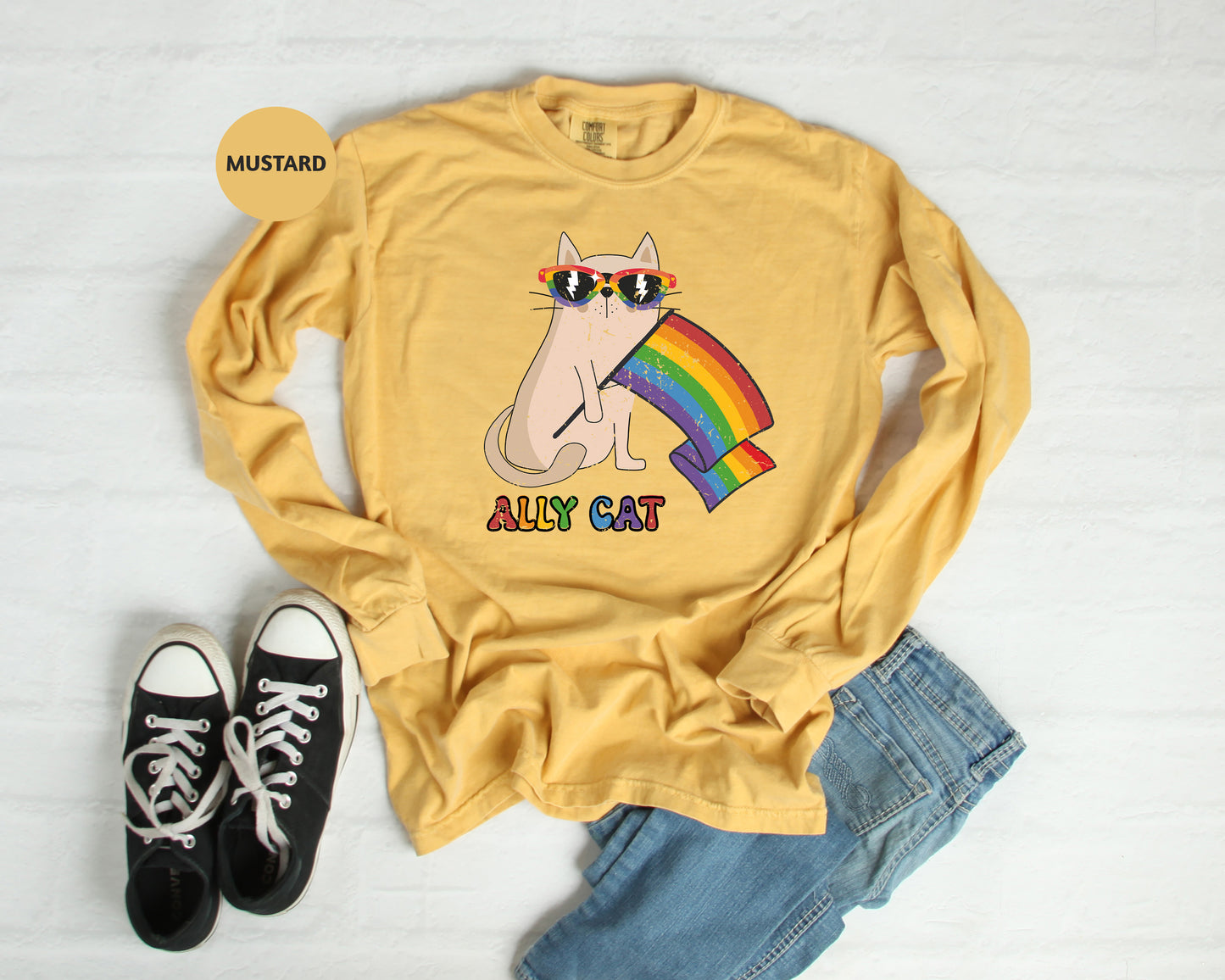 a yellow shirt with a cat wearing sunglasses