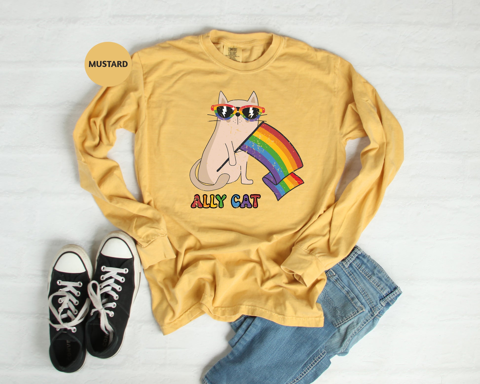 a yellow shirt with a cat wearing sunglasses