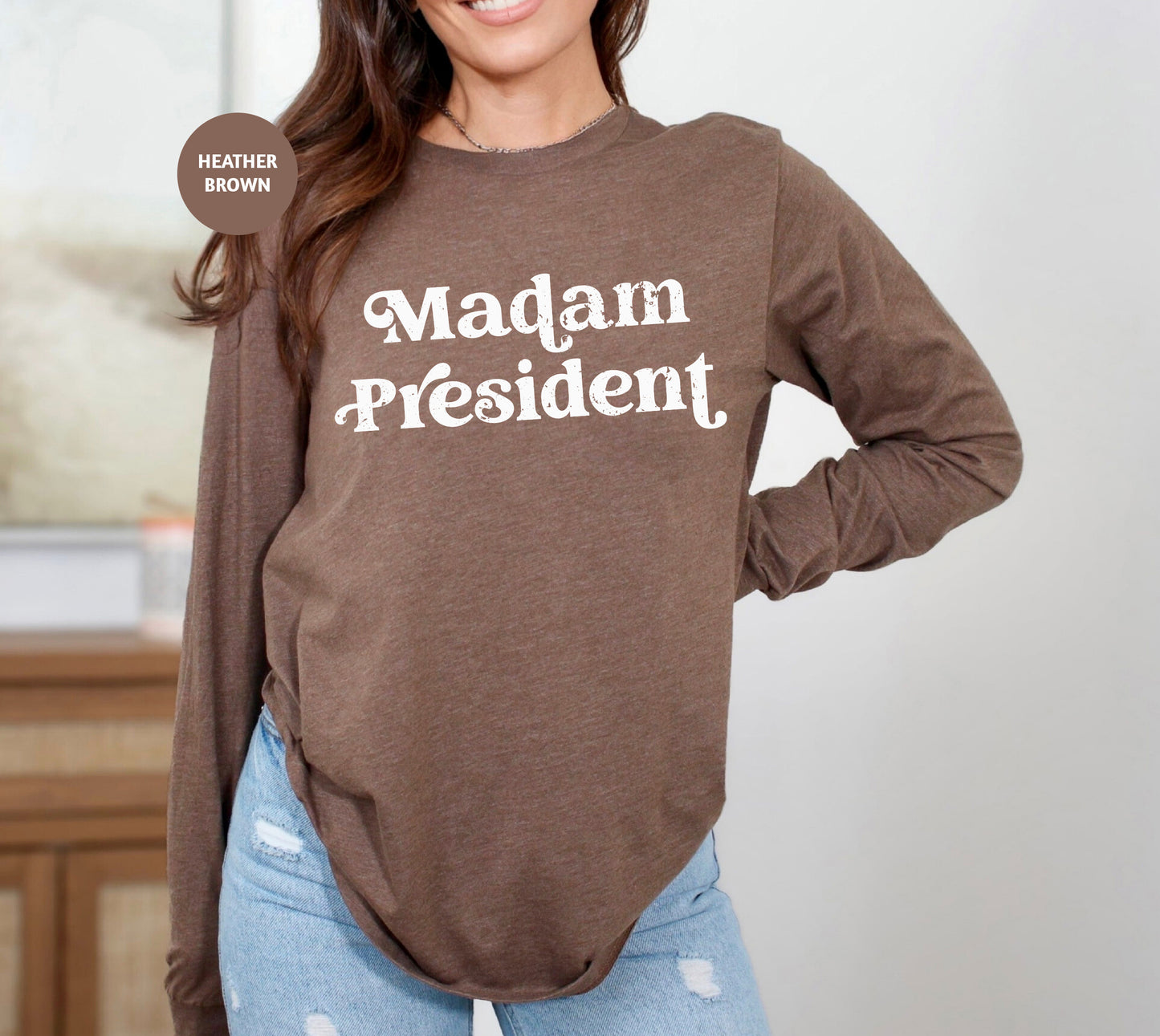 a woman wearing a brown shirt that says madam president