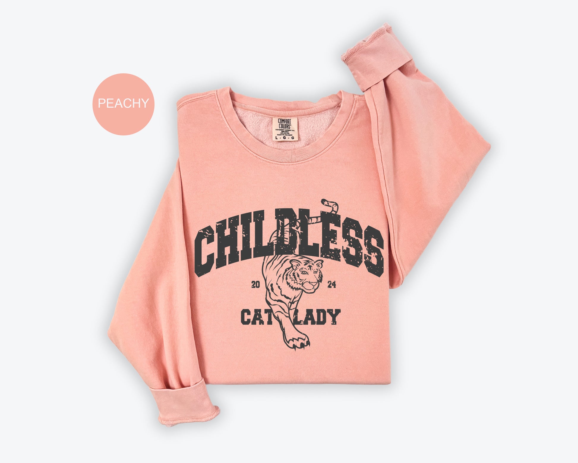 a baby girl's pink shirt with a tiger on it