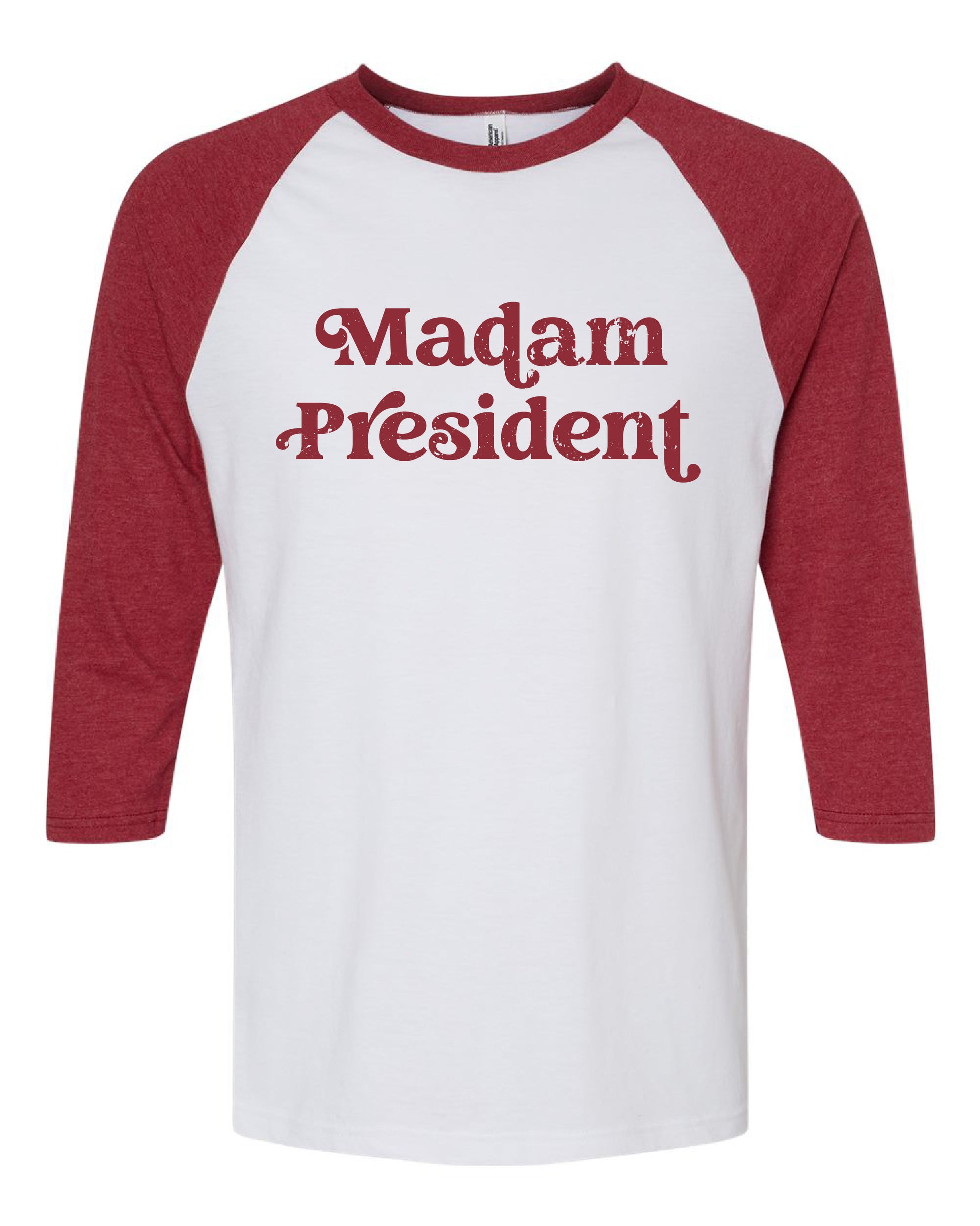a red and white shirt that says madam president