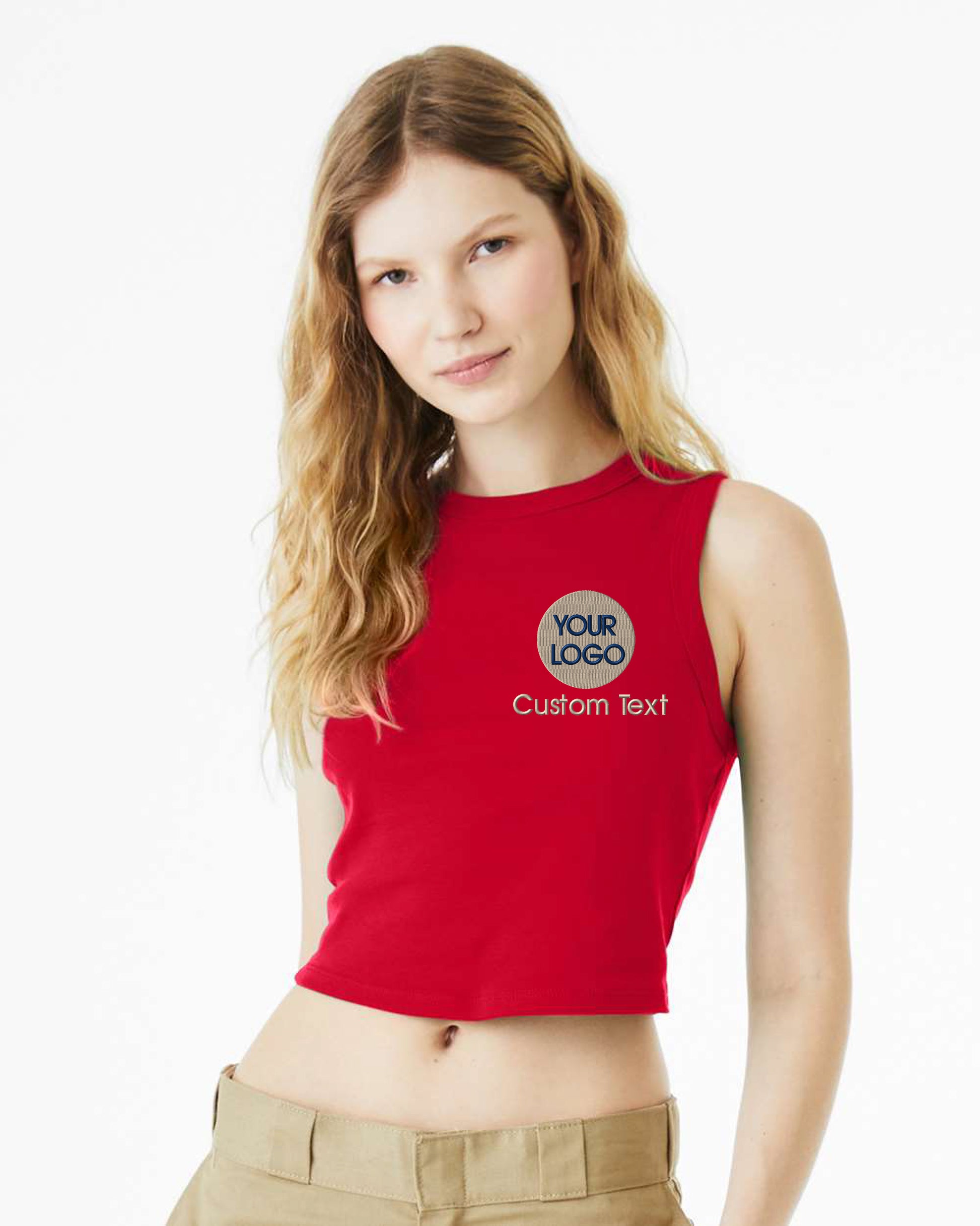 a woman wearing a red crop top and khaki pants