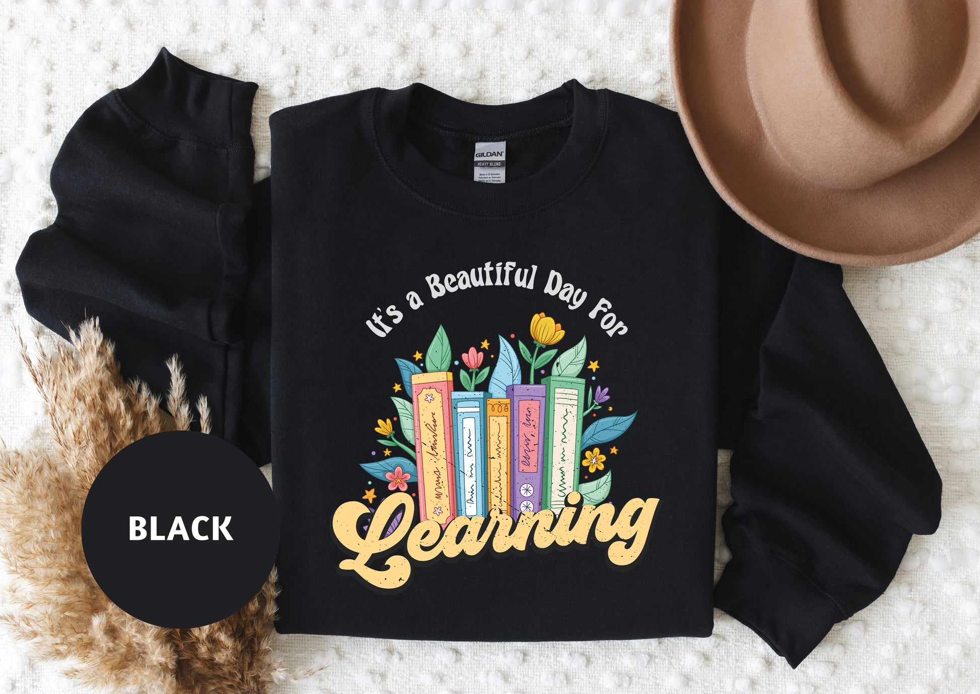 a black shirt that says it's a beautiful day for learning