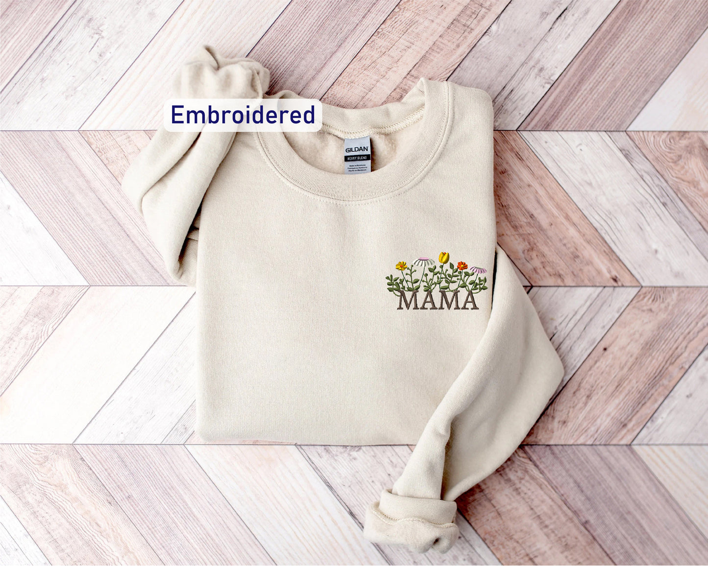 a white sweater with the word embroidered on it