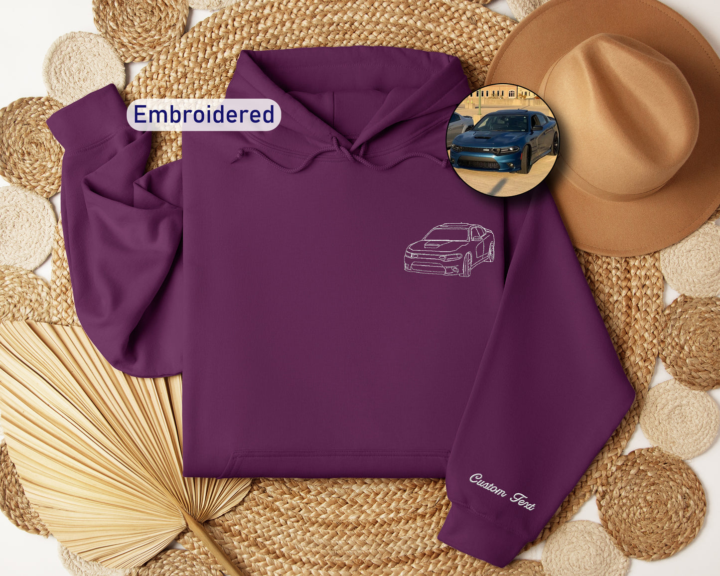 a purple hoodie with a picture of a car on it