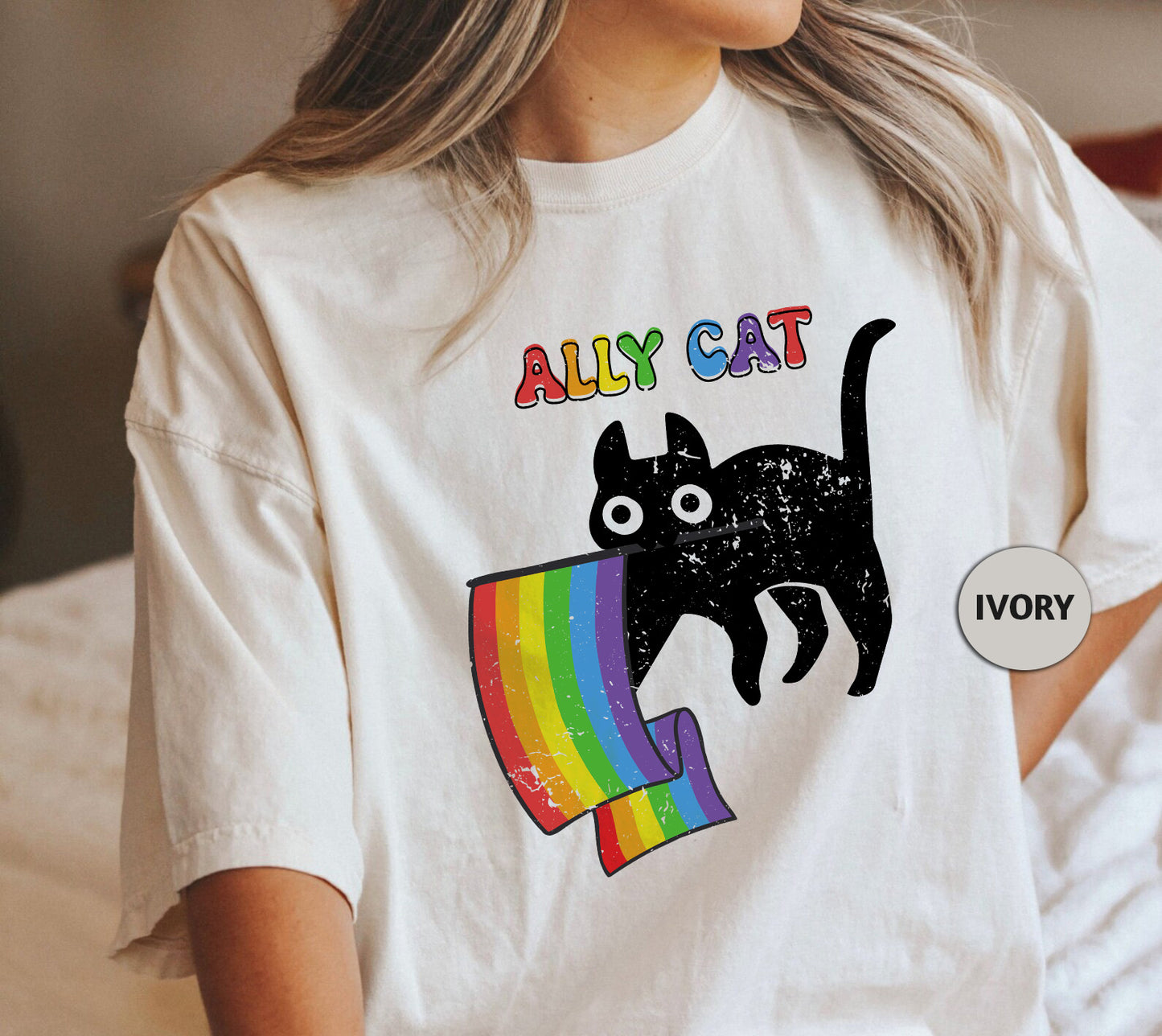 a woman wearing a t - shirt with a cat on it