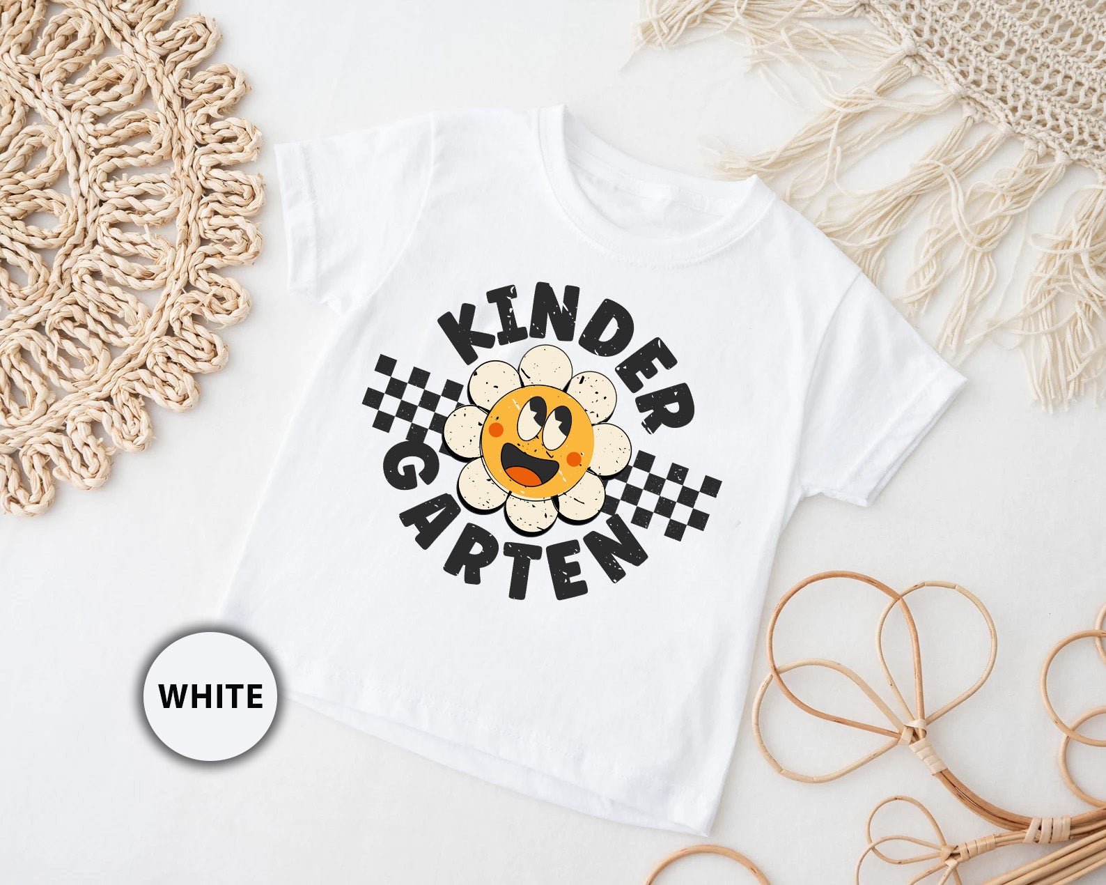 a kid's t - shirt with the words kinder garden printed on it