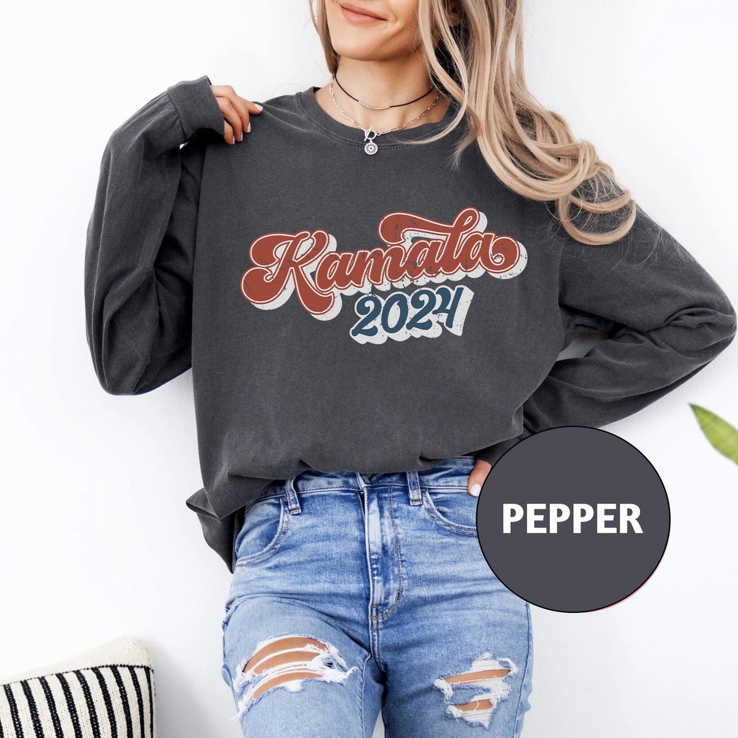 a woman wearing a black sweatshirt with the words peper printed on it