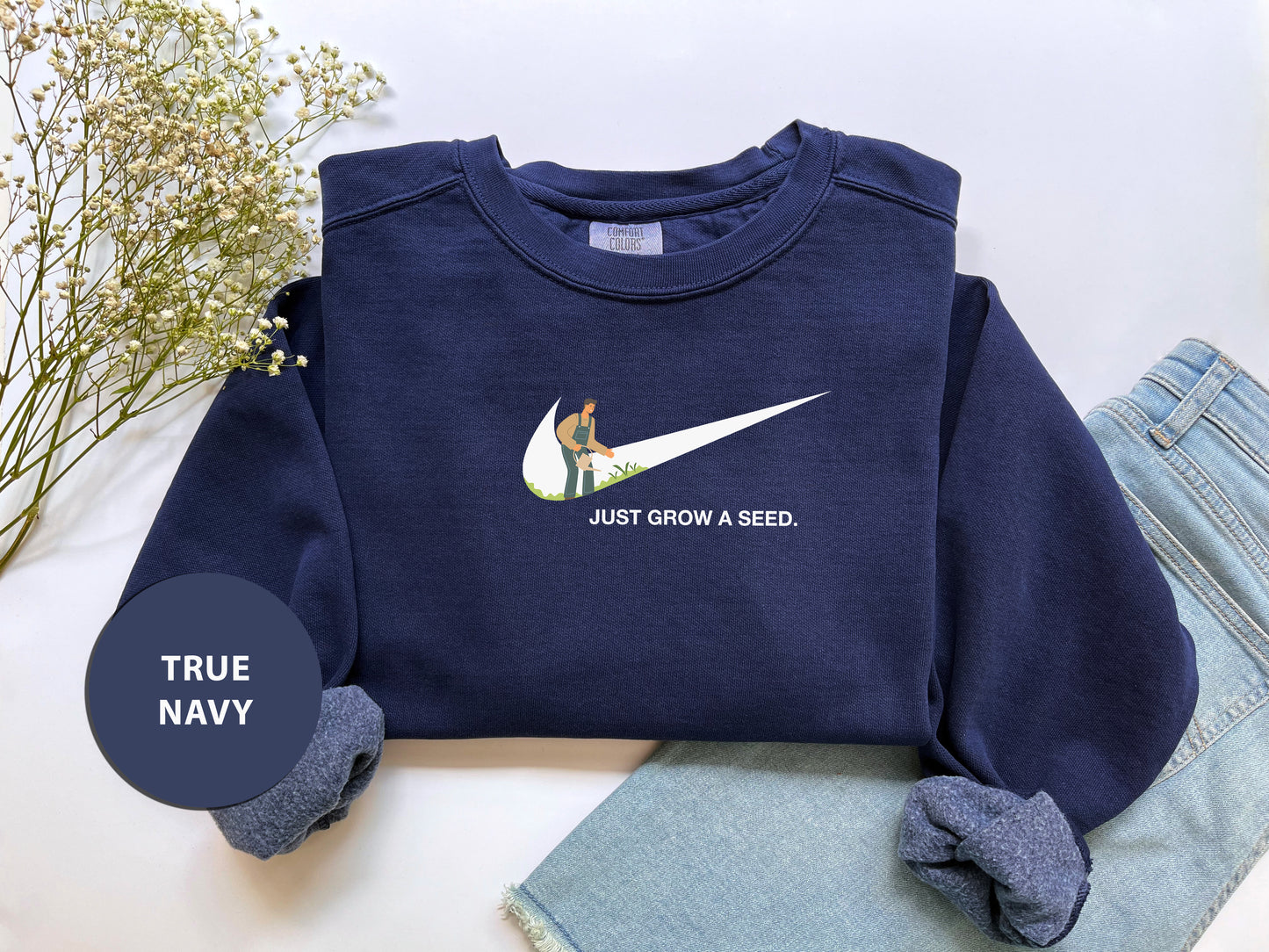 a blue sweatshirt with a white nike logo on it