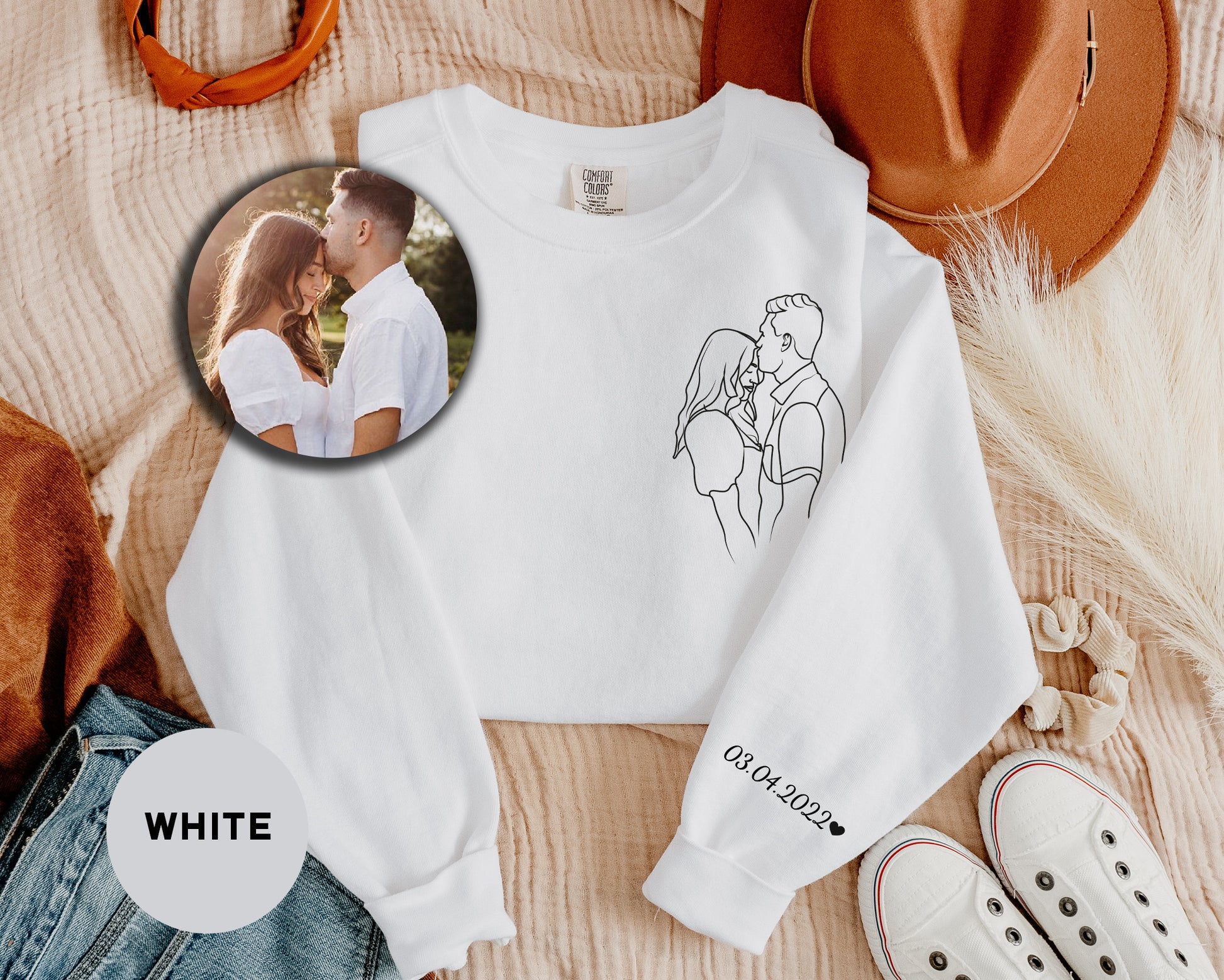 a white shirt with a picture of a couple on it