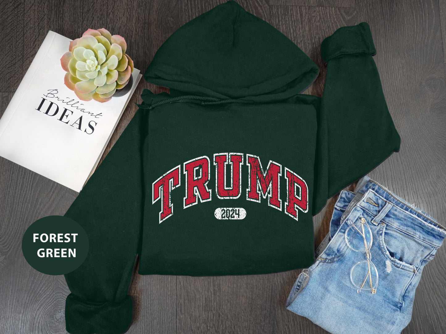 a green hoodie with the word trump printed on it