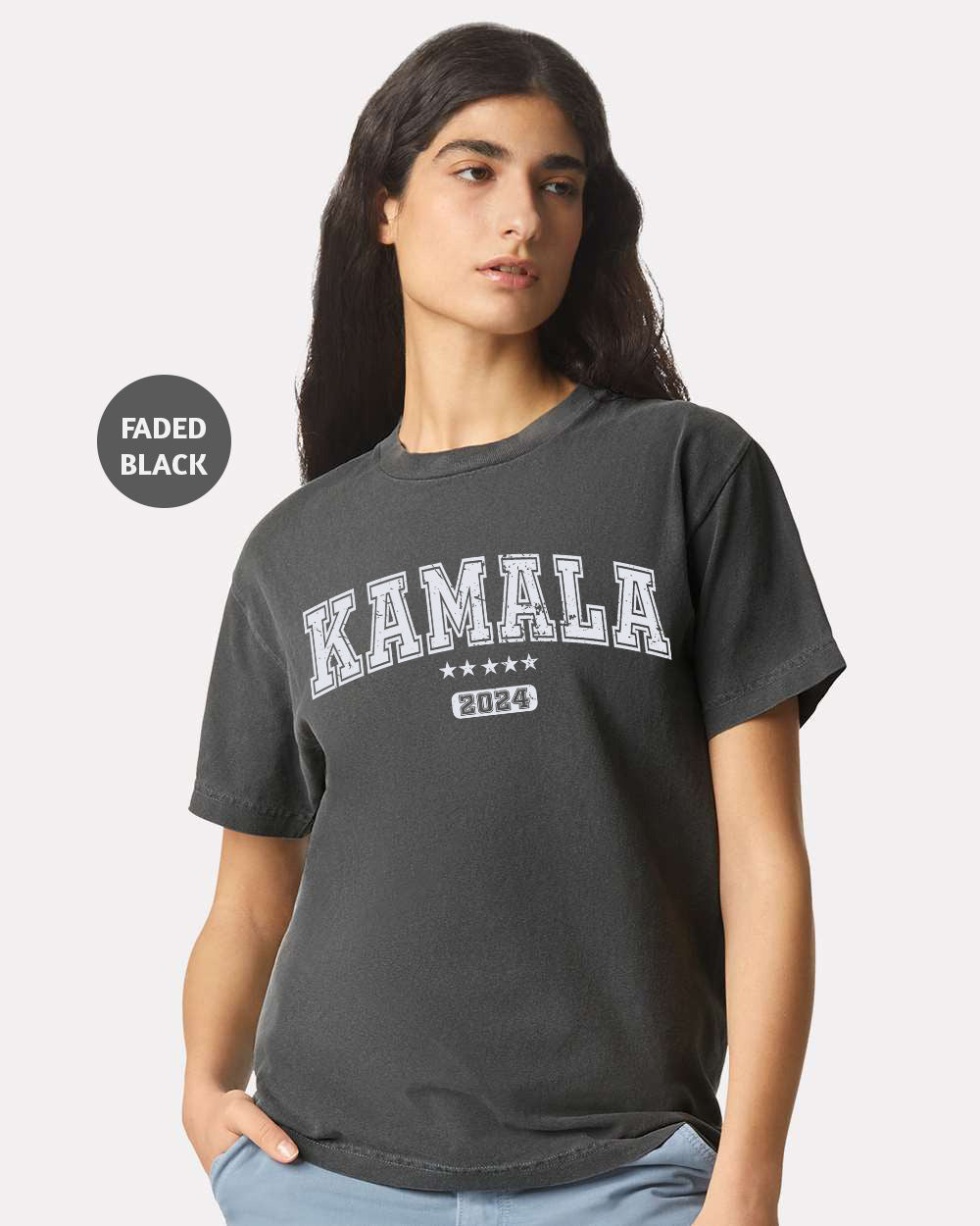 a woman wearing a black t - shirt with the word karma printed on it