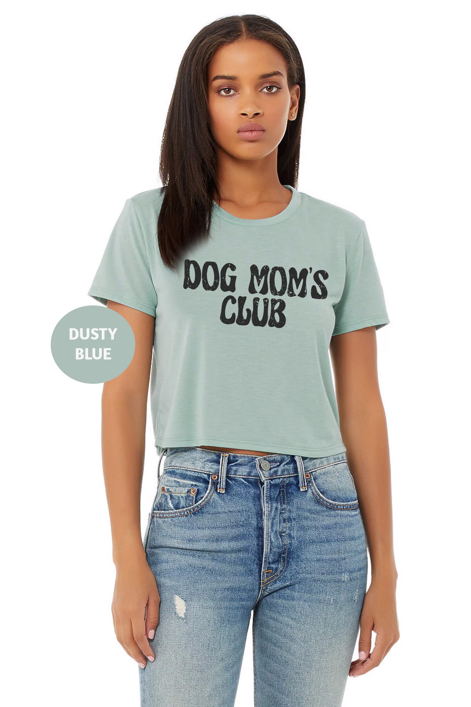 a woman wearing a dog mom's club t - shirt