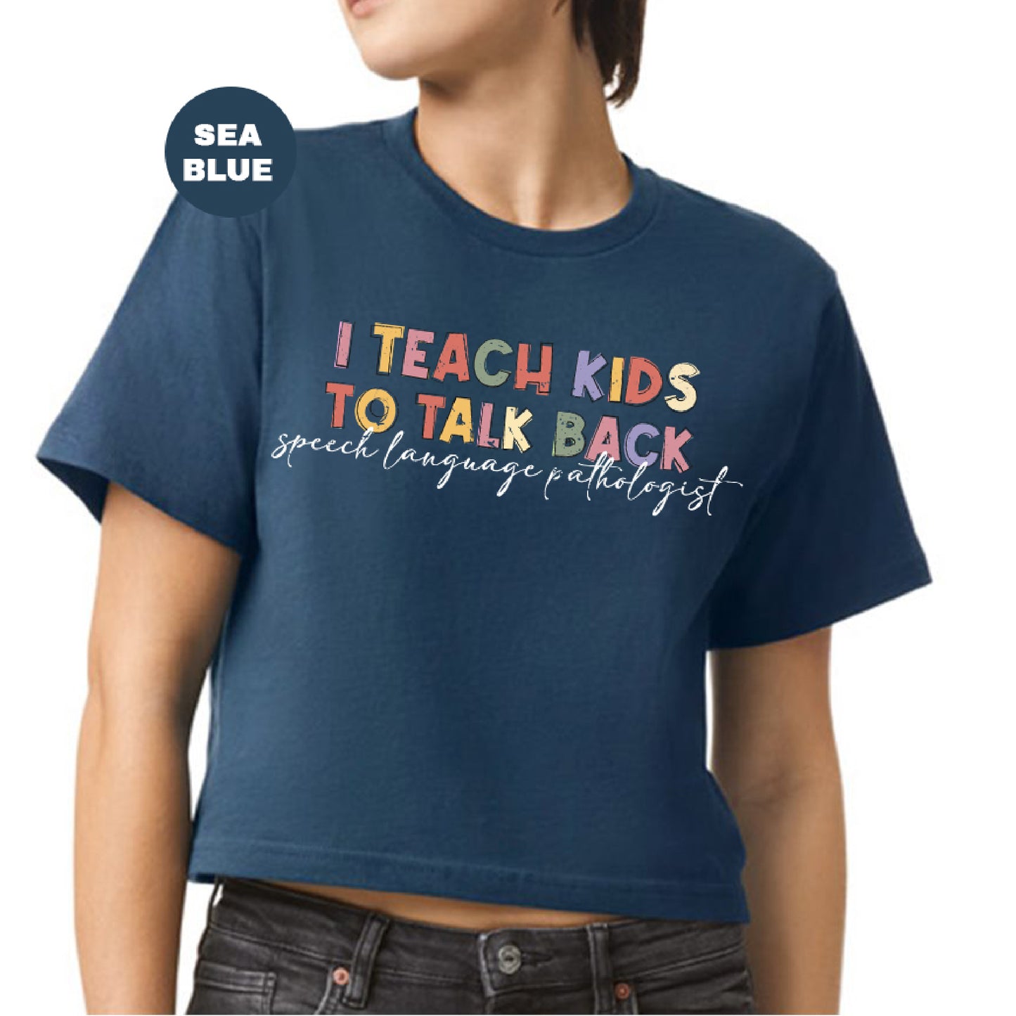 a woman wearing a t - shirt that says i teach kids to talk back