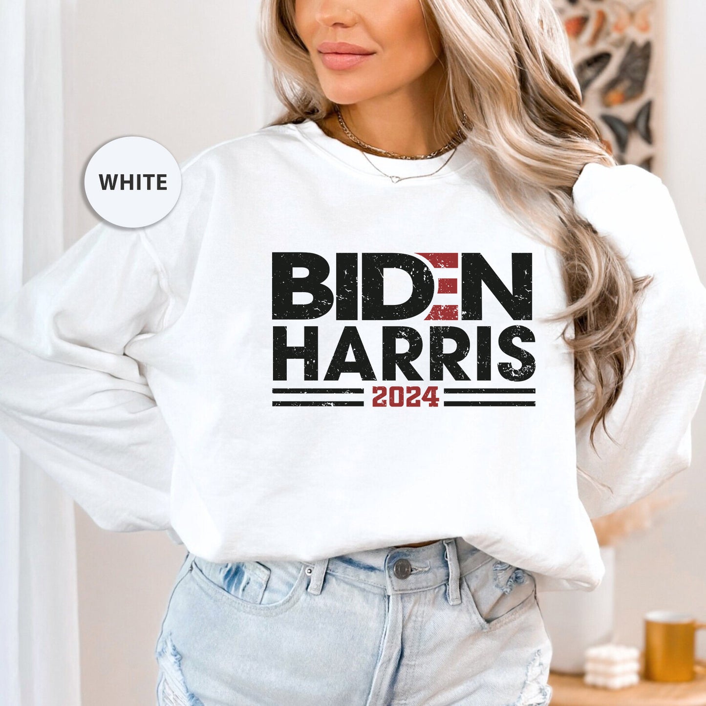 a woman wearing a white sweatshirt with bidn harris on it