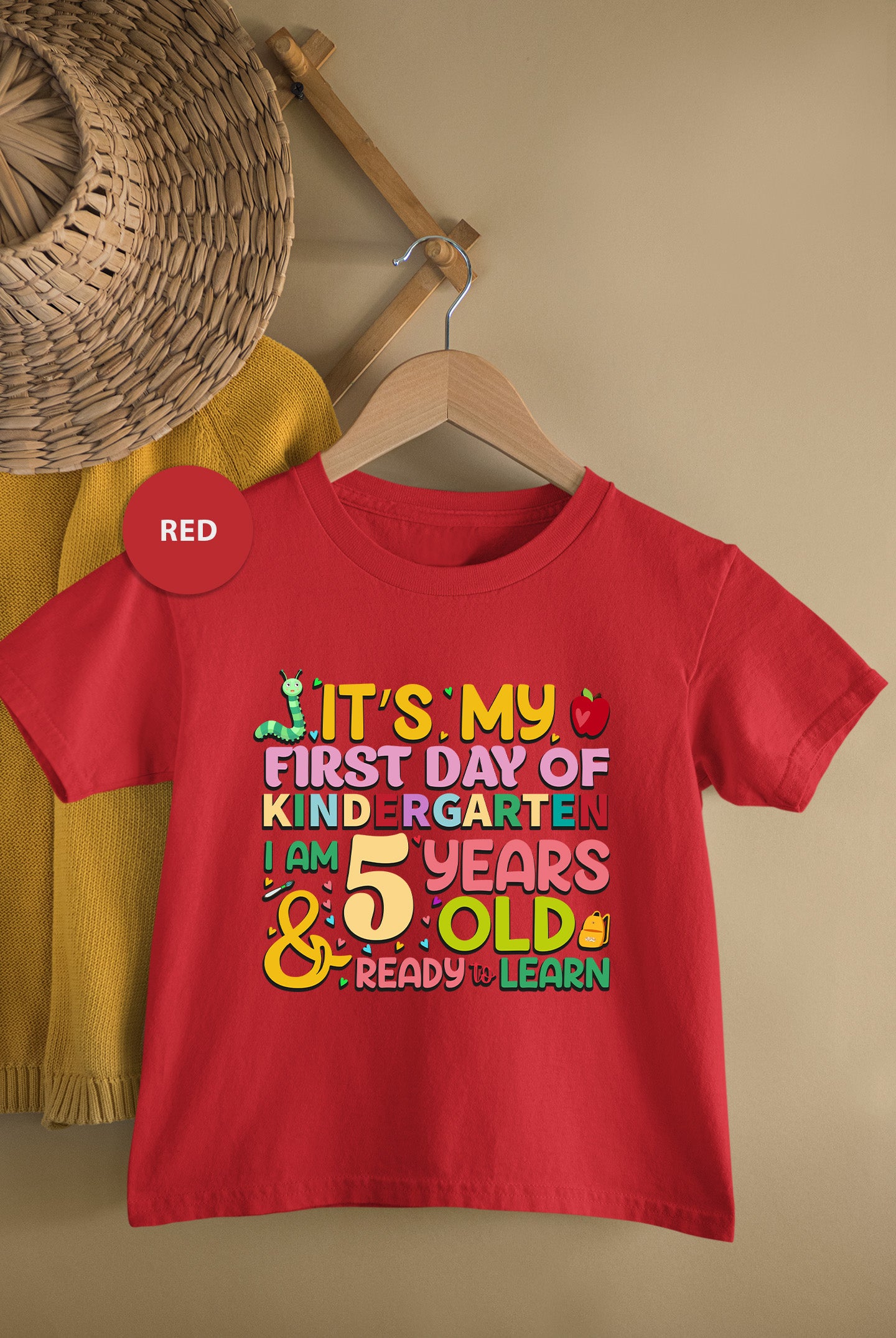 a t - shirt with the words it's my first day of kind -