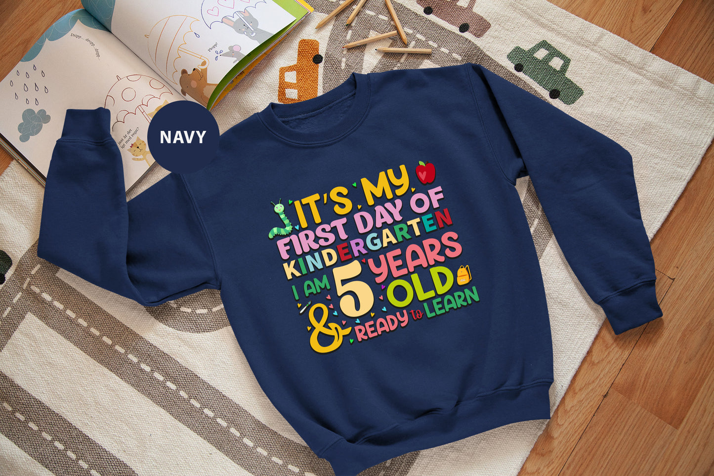a child's sweatshirt that says it's my first day of kind of