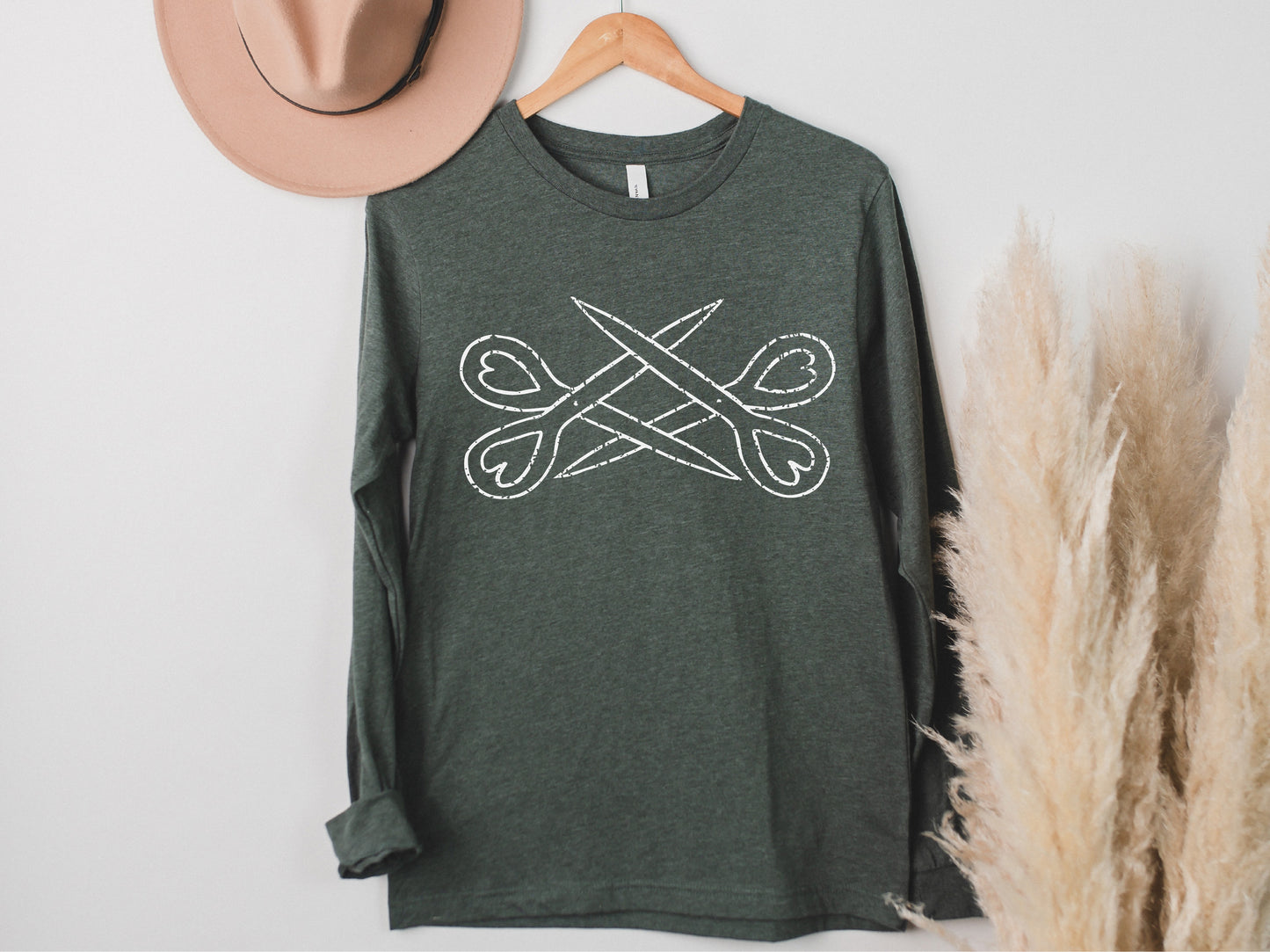 a hat and a t - shirt hanging on a wall