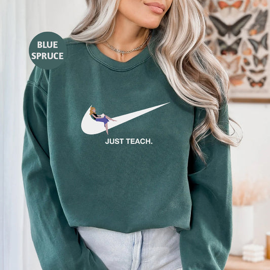a woman wearing a green sweatshirt with a white nike logo