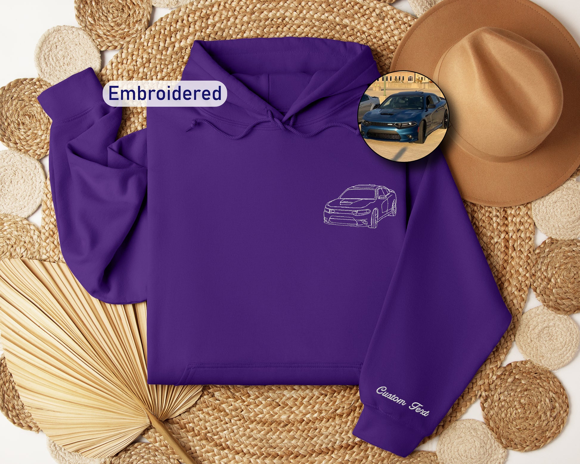 a purple hoodie with a picture of a car on it