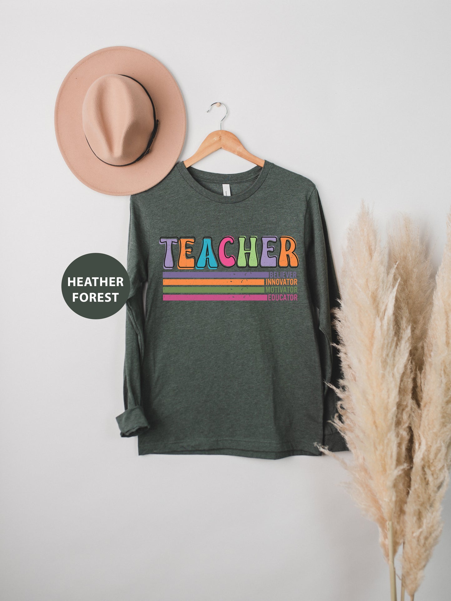 a hat and a t - shirt hanging on a wall