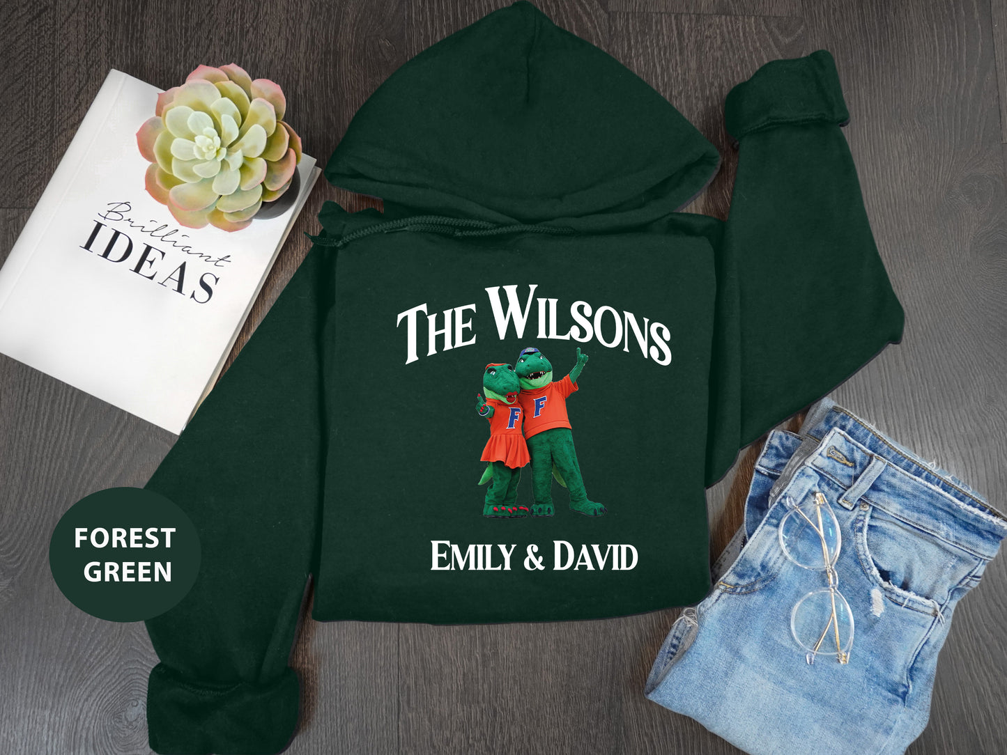 a green hoodie with the words, the wilsons, and an image of