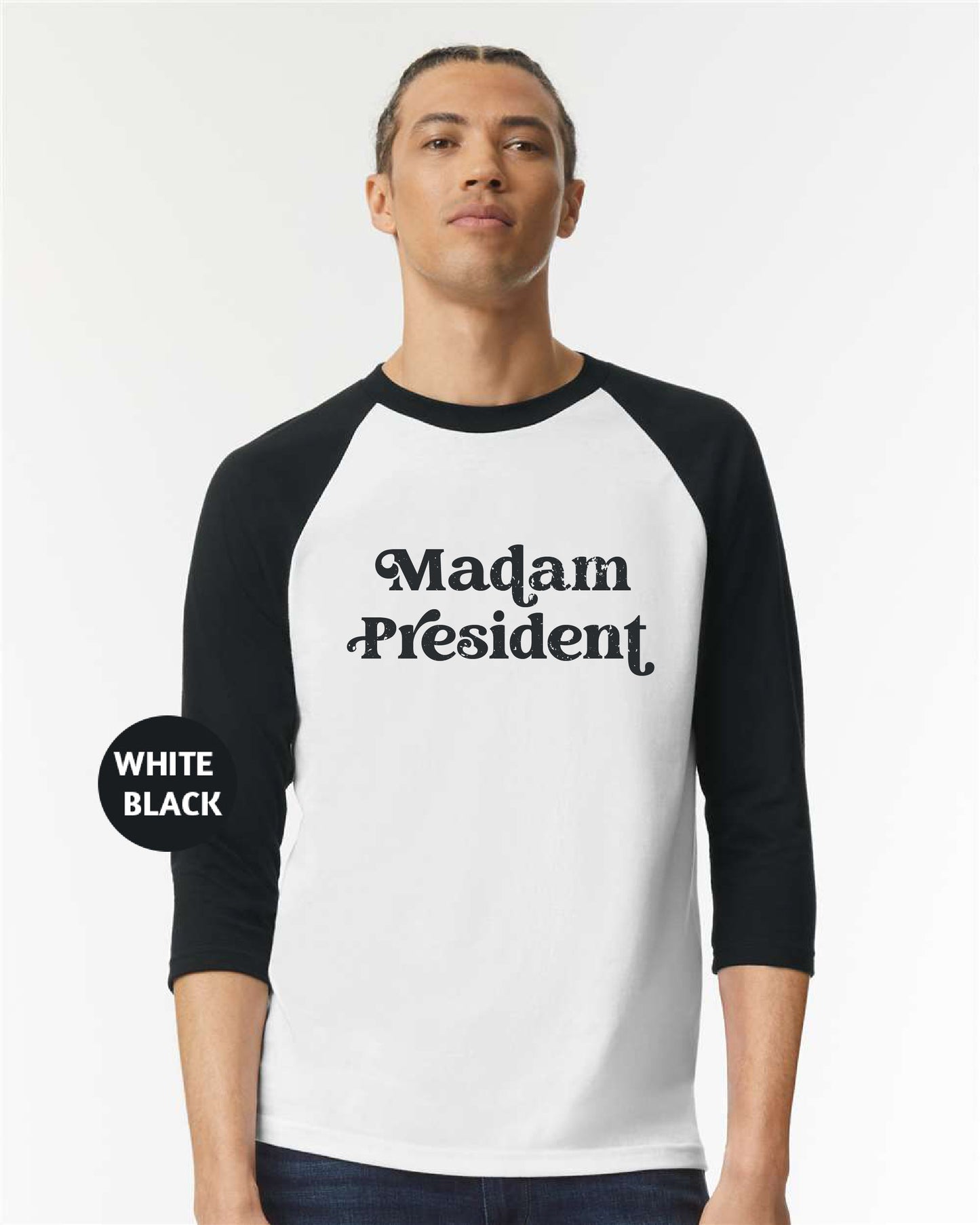 a man wearing a black and white shirt with the words madam president printed on it