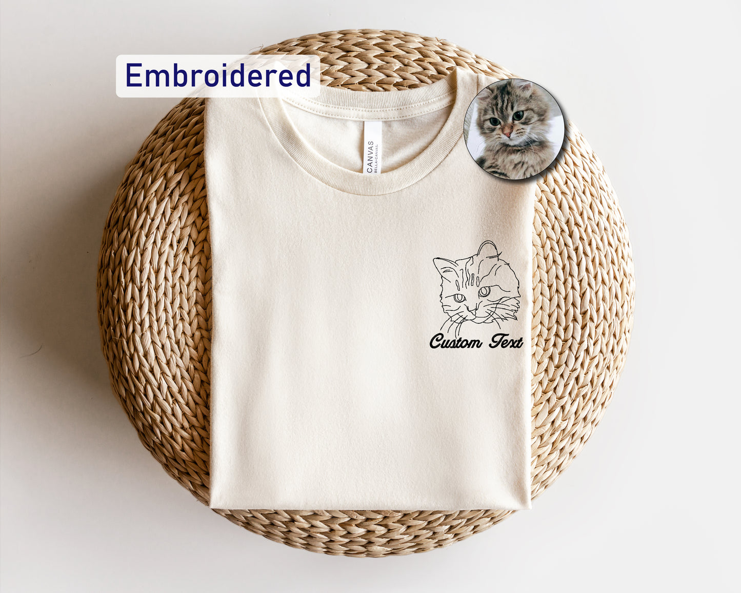 a white t - shirt with a cat on it