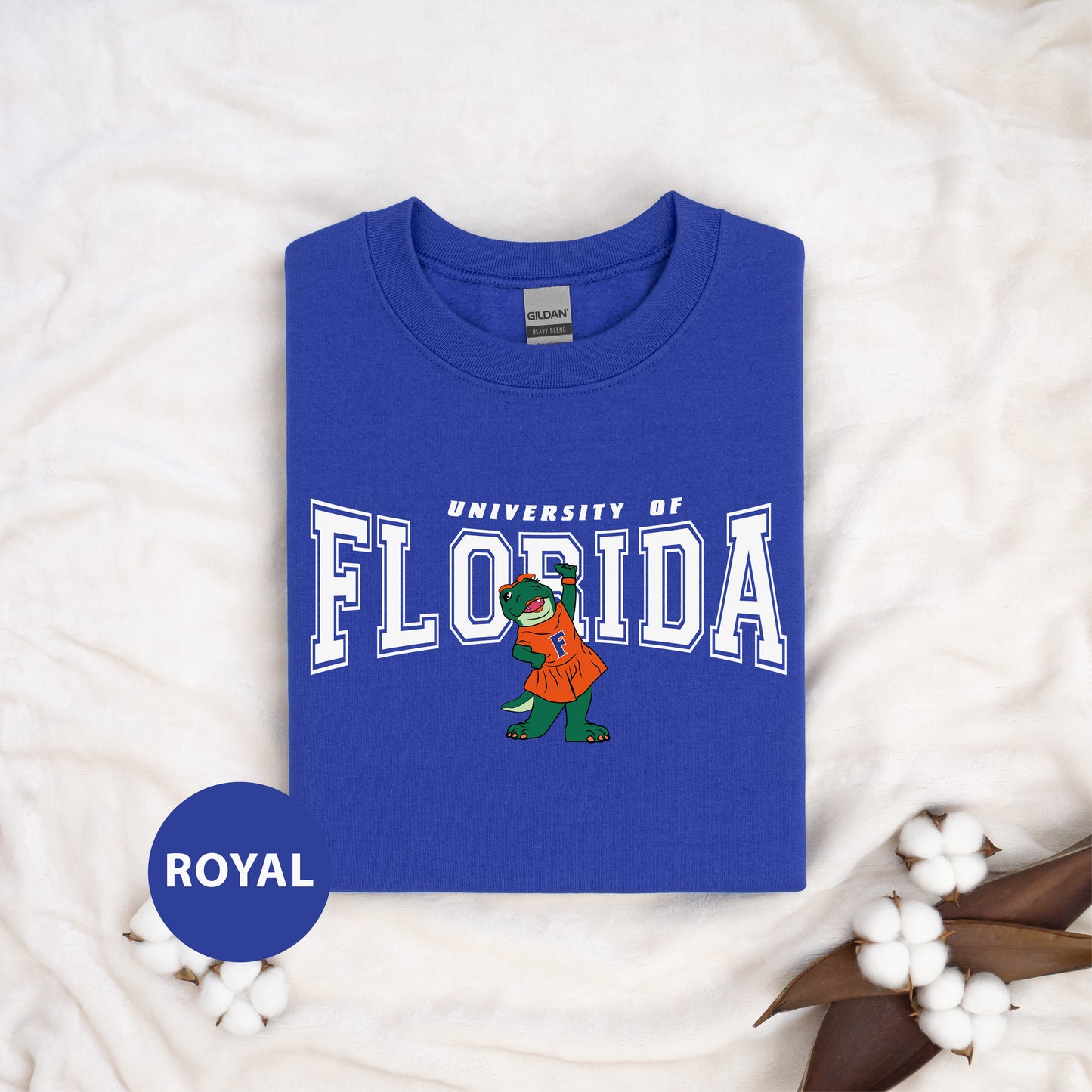 a blue shirt with the university of florida mascot on it