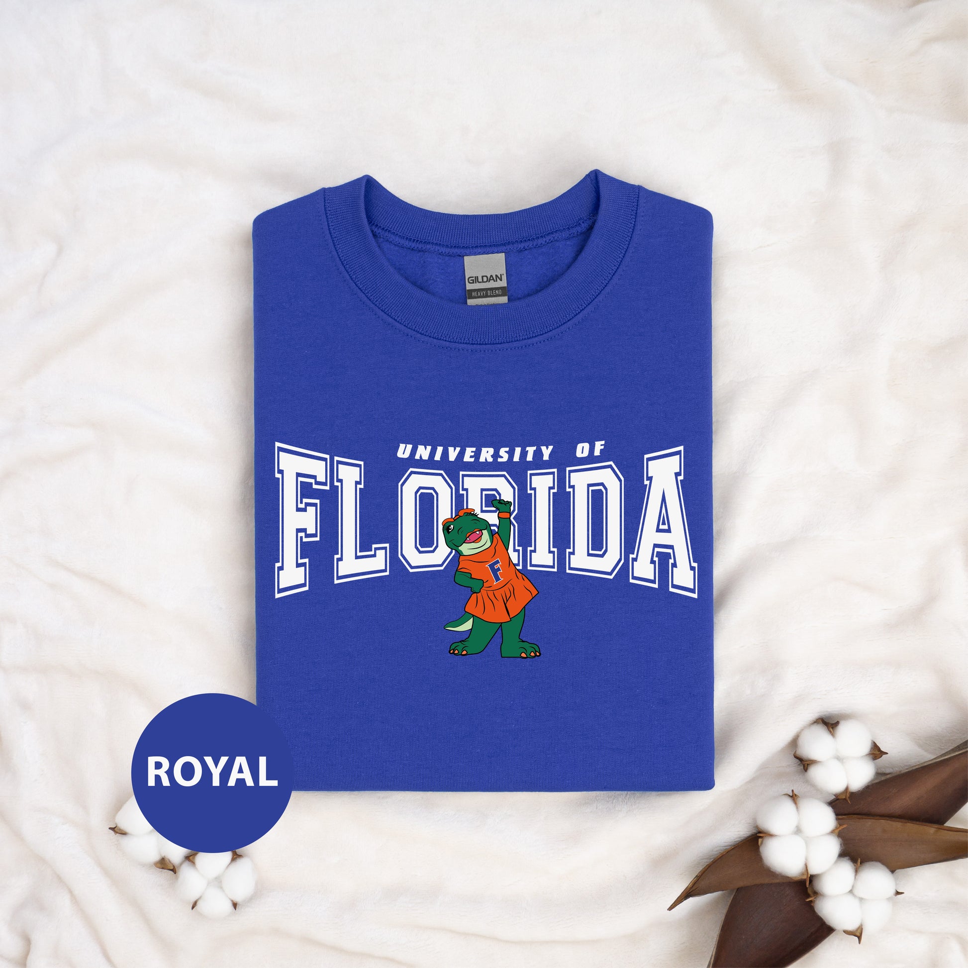 a blue shirt with the university of florida mascot on it