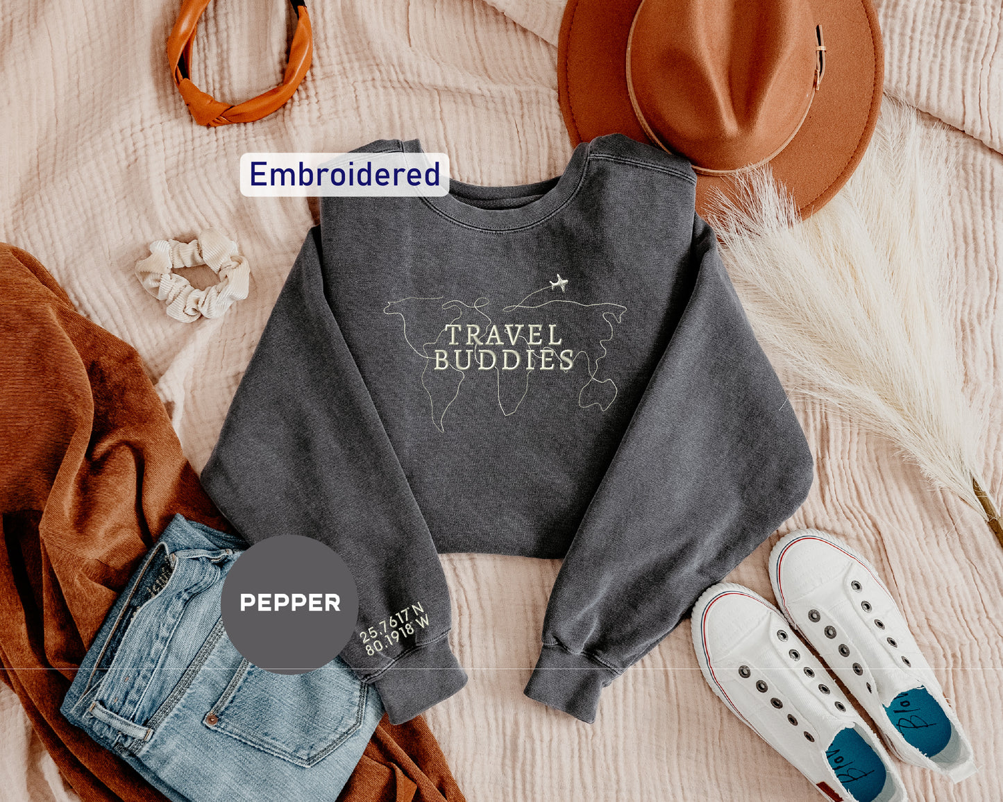 a sweater with the words travel buddies printed on it