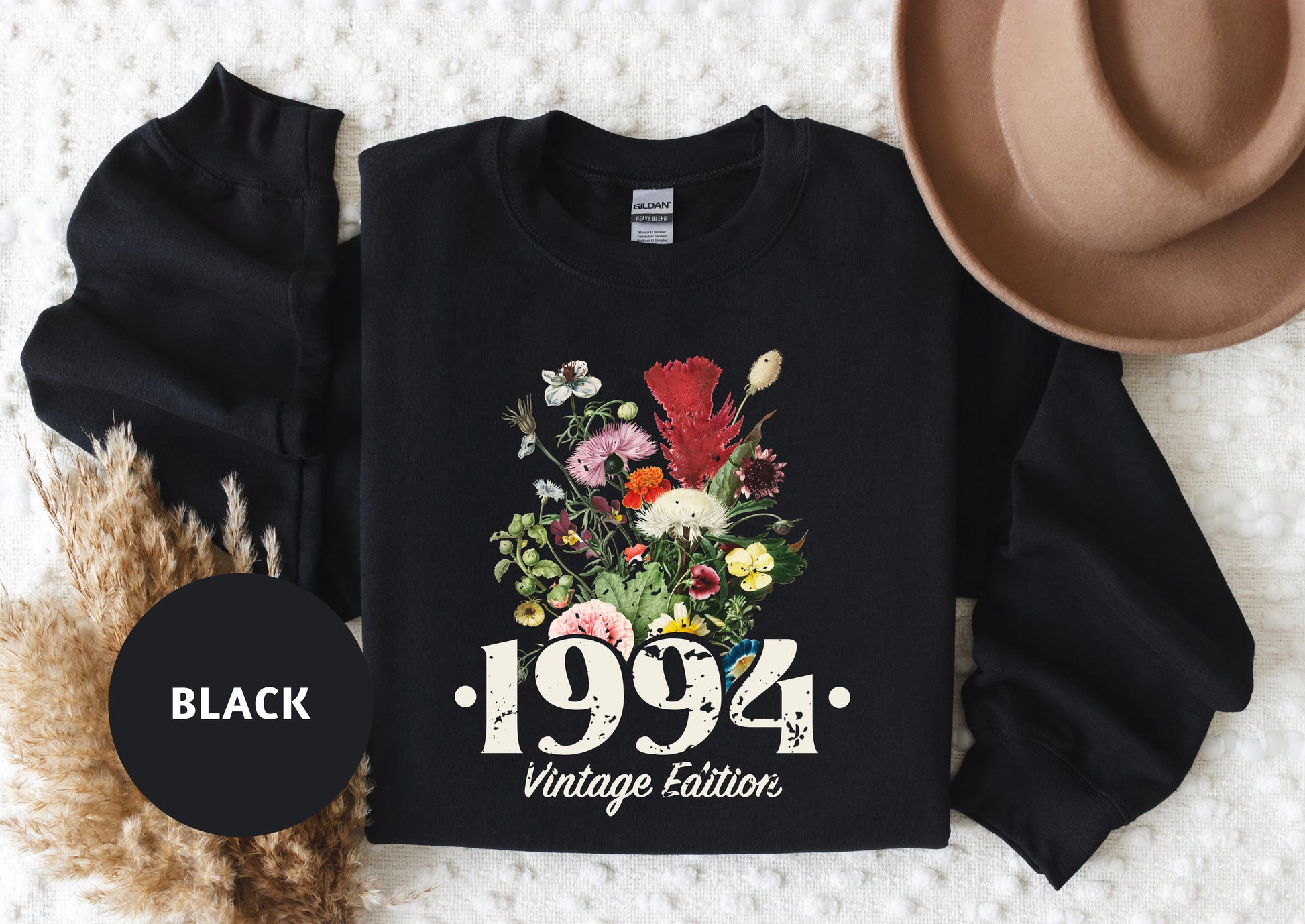 a black shirt with a floral bouquet on it