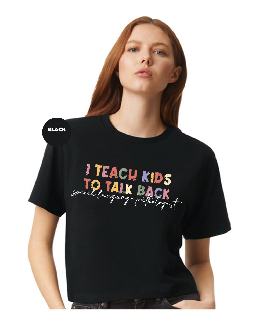 a woman wearing a black t - shirt that says i teach kids to talk back