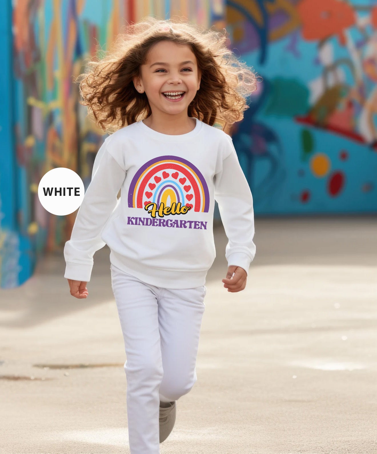 a little girl running in front of a colorful wall