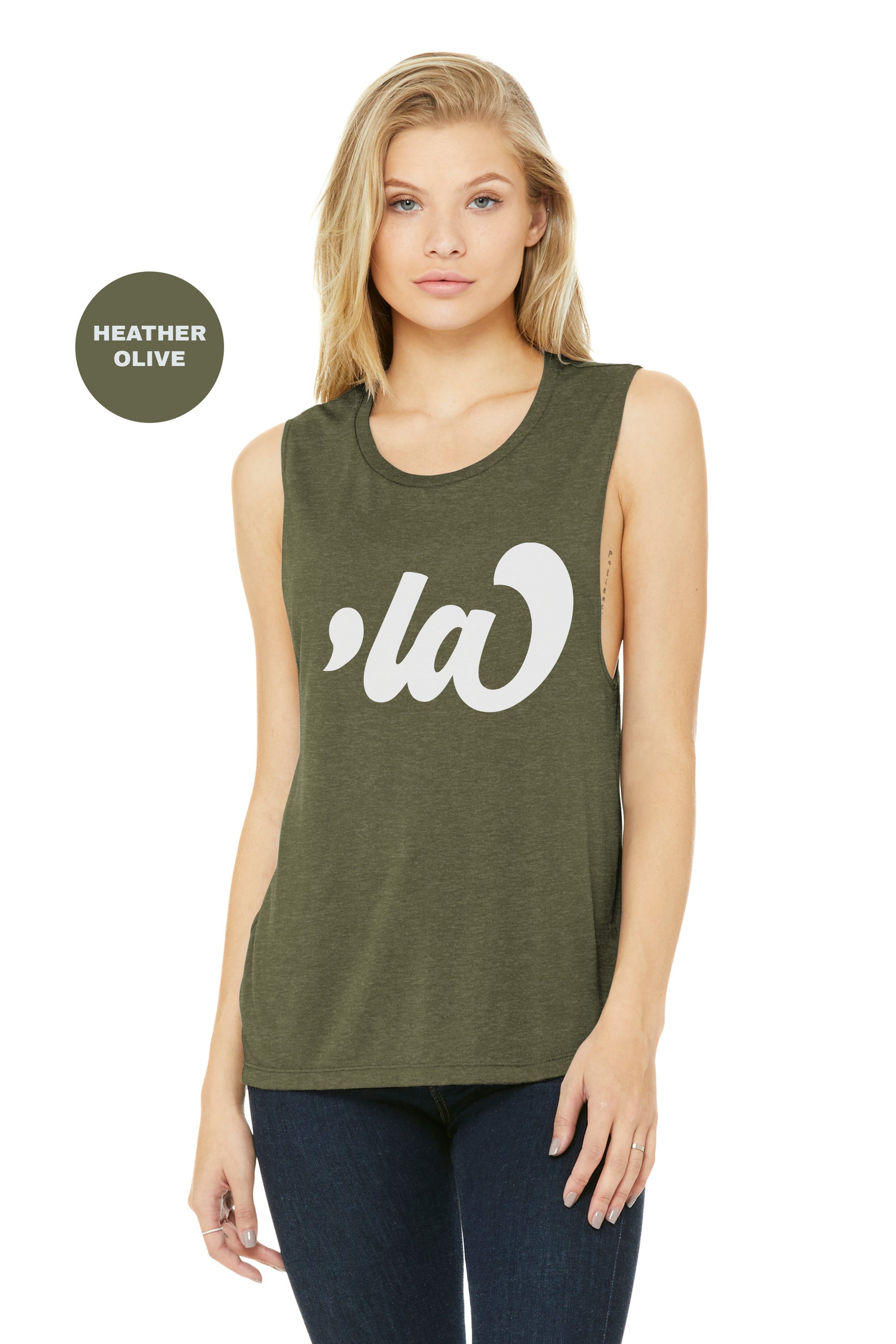 a woman wearing a green tank top with a white logo