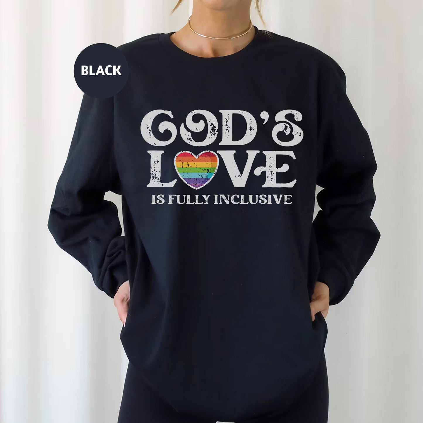 a woman wearing a black sweatshirt that says god's love is fully inclusive