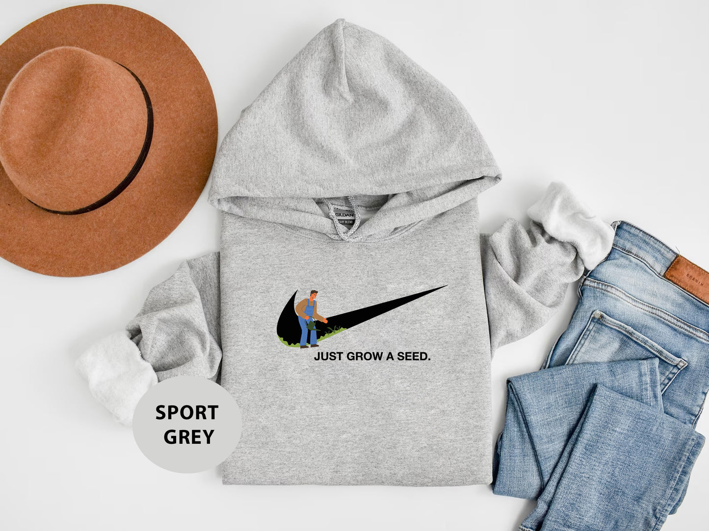 a hoodie with a hat, jeans, and a pair of shoes