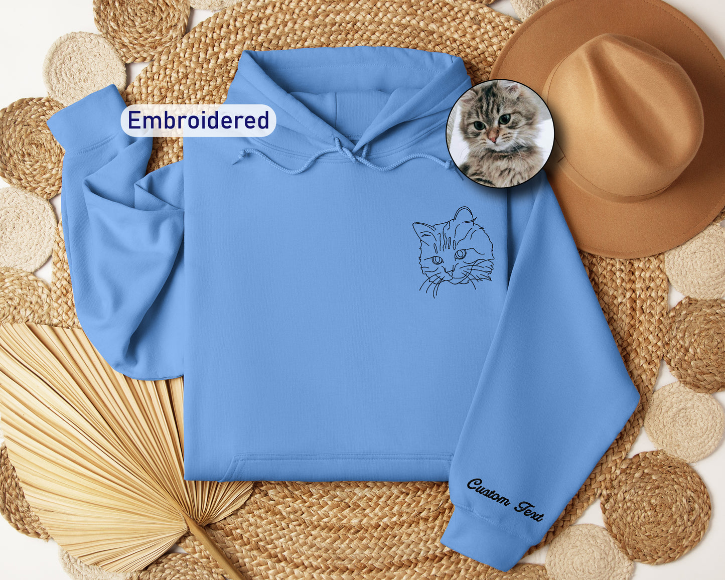 a blue hoodie with a picture of a cat on it
