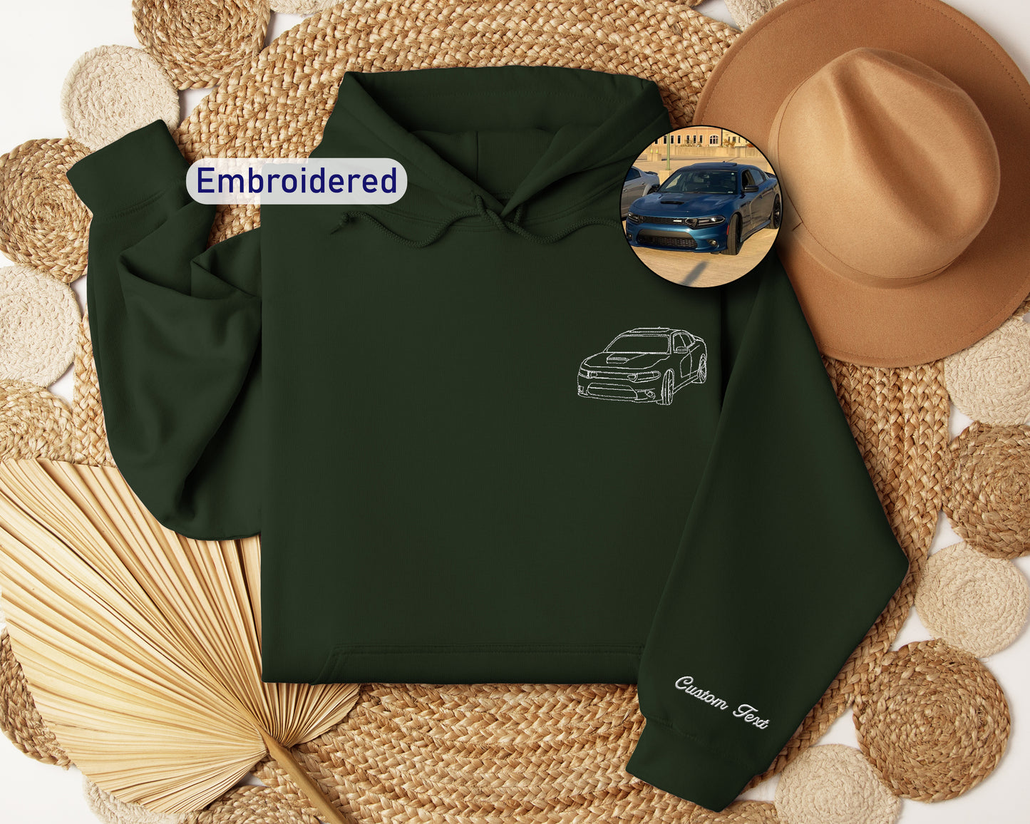 a green hoodie with a picture of a car on it