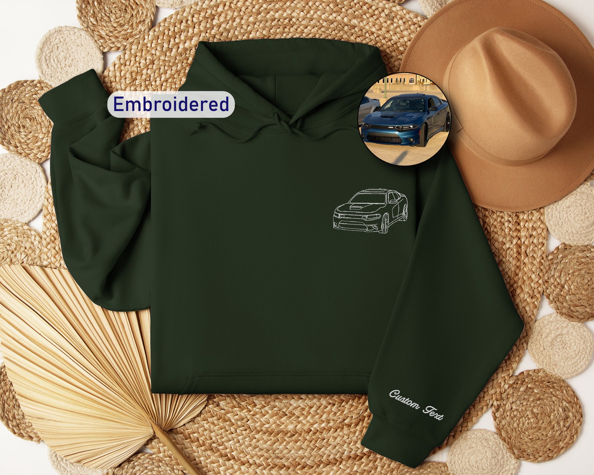 a green hoodie with a picture of a car on it