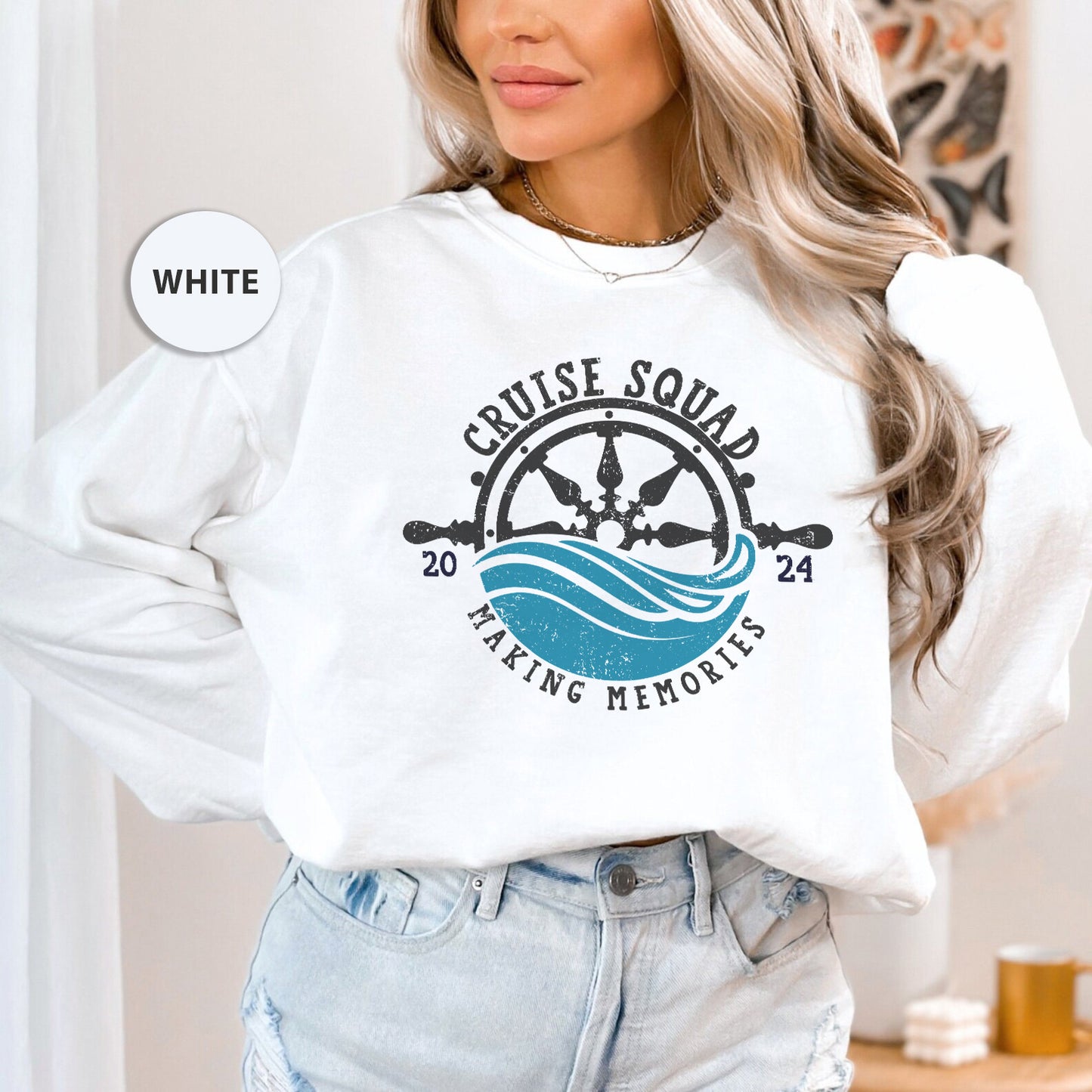 a woman wearing a white cruise squad sweatshirt