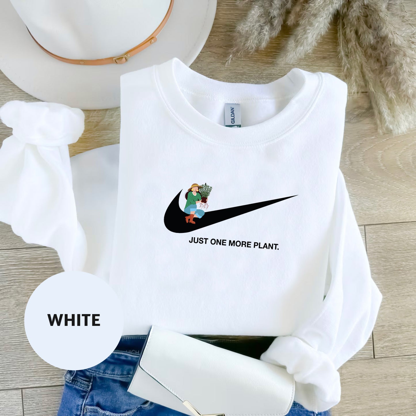 a white shirt with a black nike logo on it