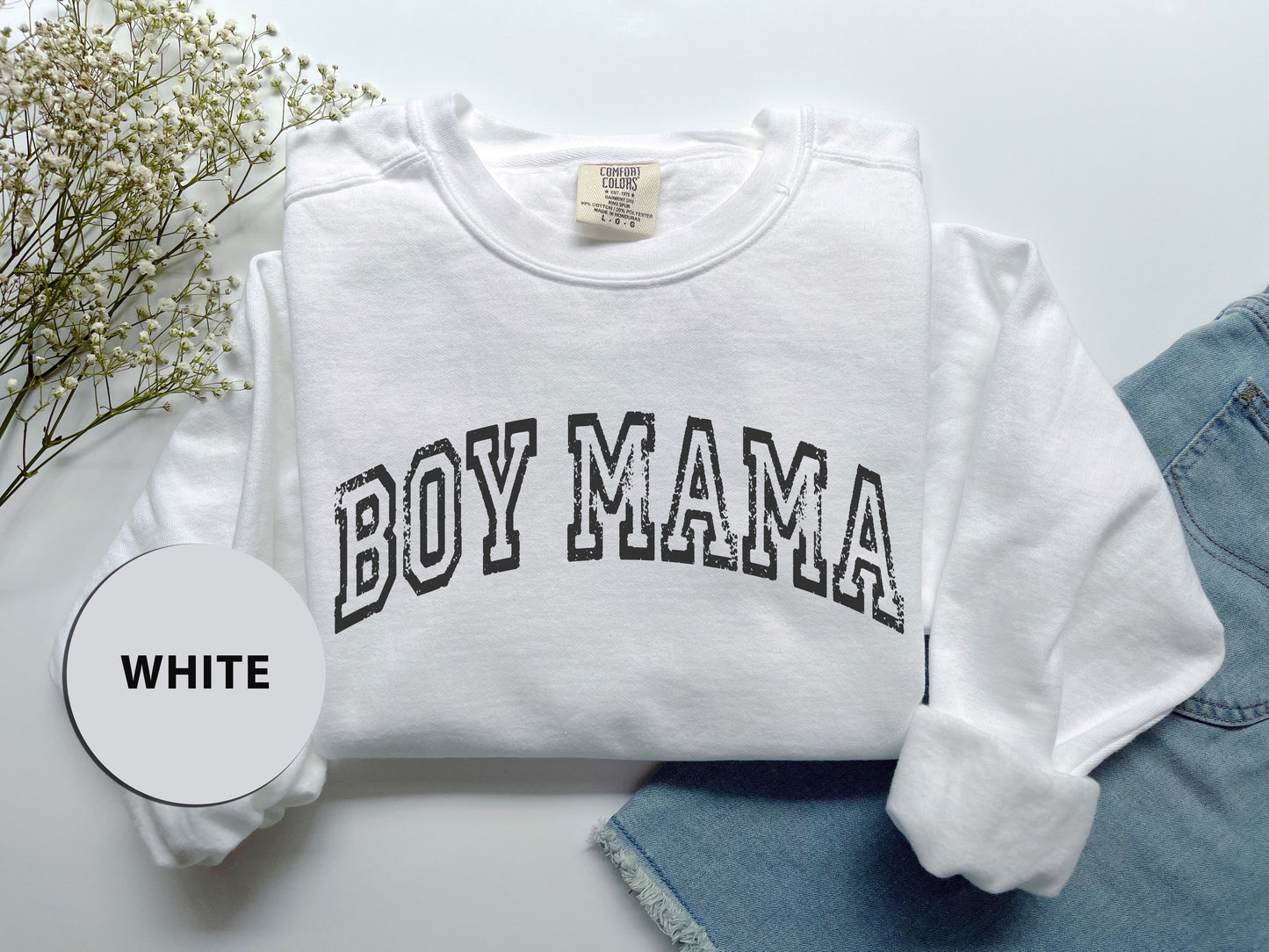 a white shirt with the word boy mama printed on it