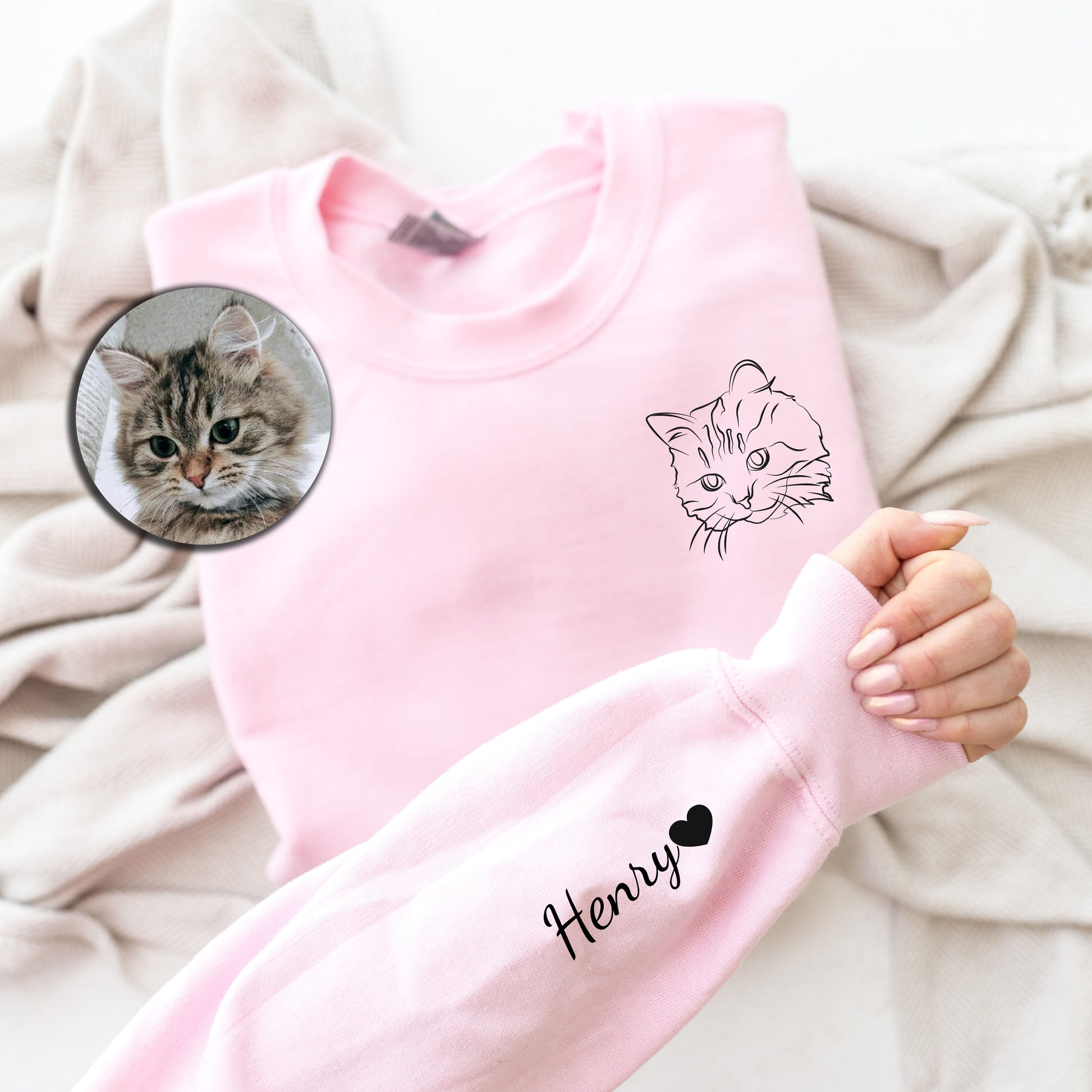 a person holding a mirror with a cat on it