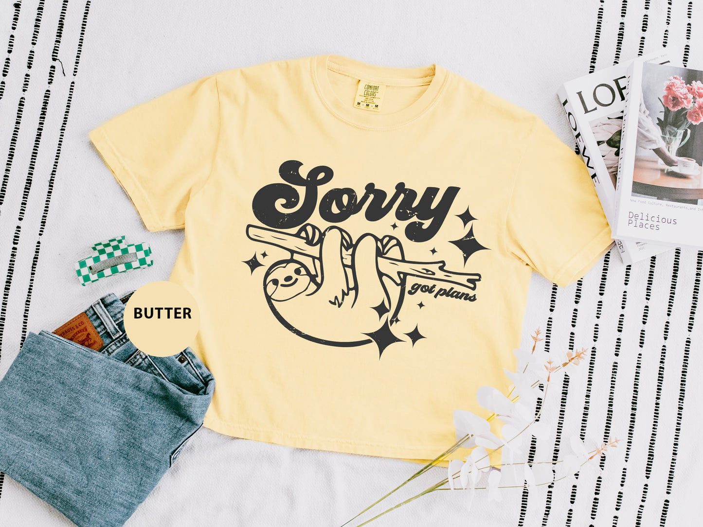 a yellow shirt with a slotty on it